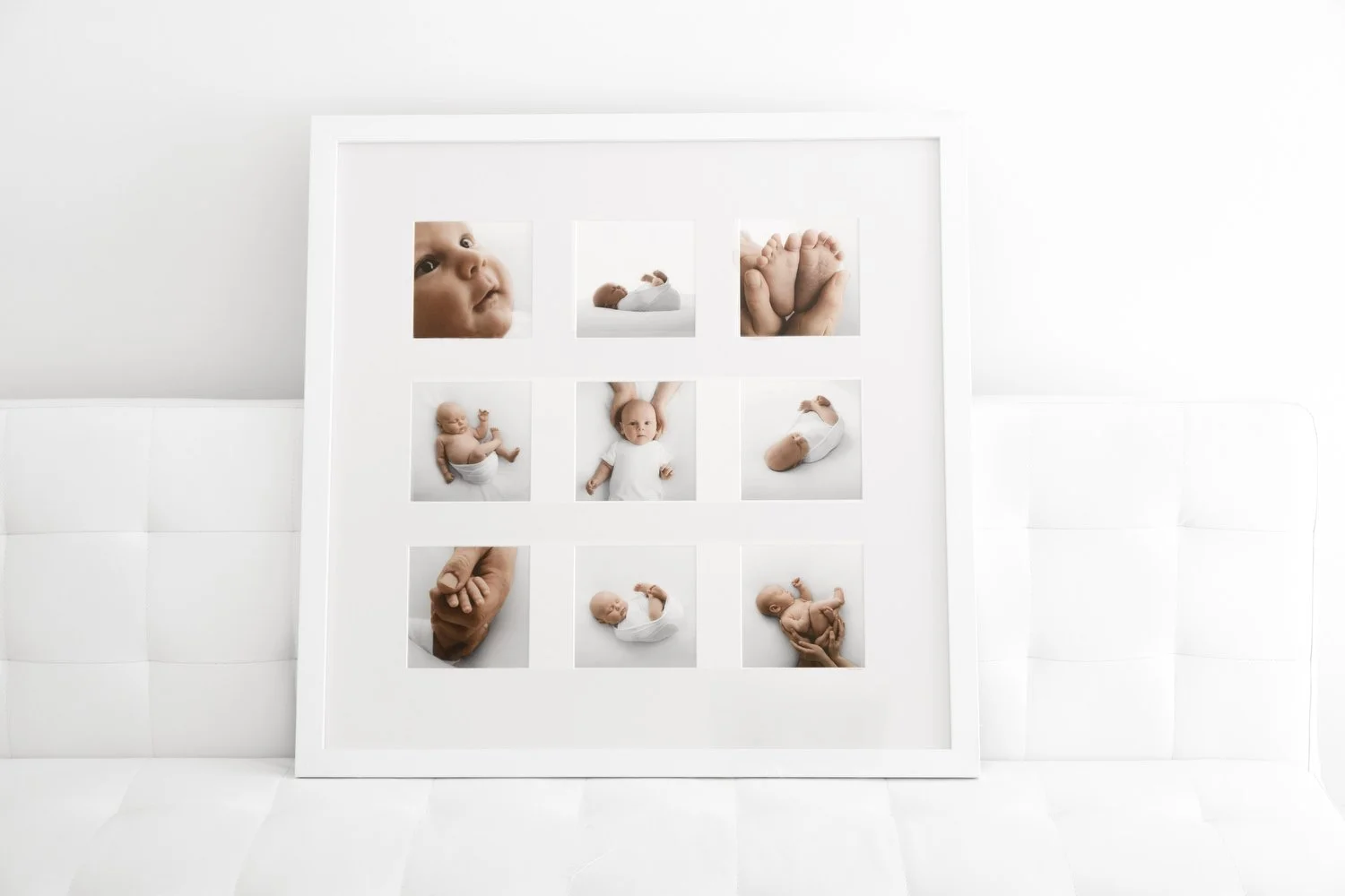 Nine-image framed newborn wall art displayed in white frame at Dundee studio