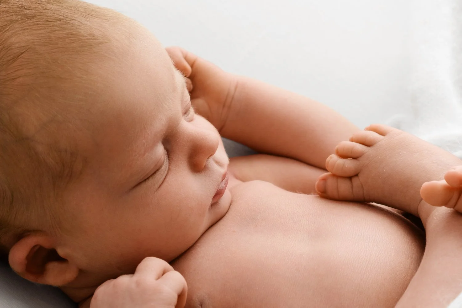 22 day old sleeping newborn baby photographed at Mabel and Moose studio Dundee