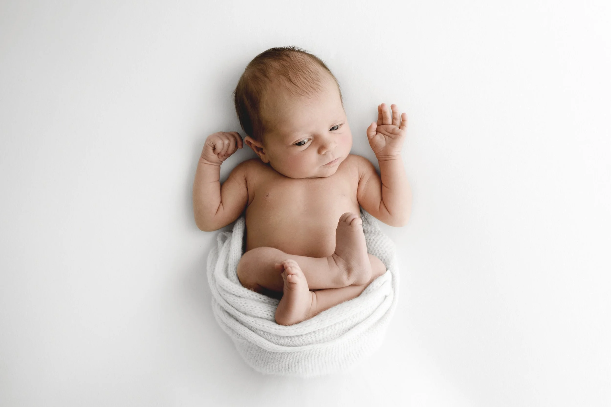 Awake newborn wrapped naturally during Dundee studio photoshoot