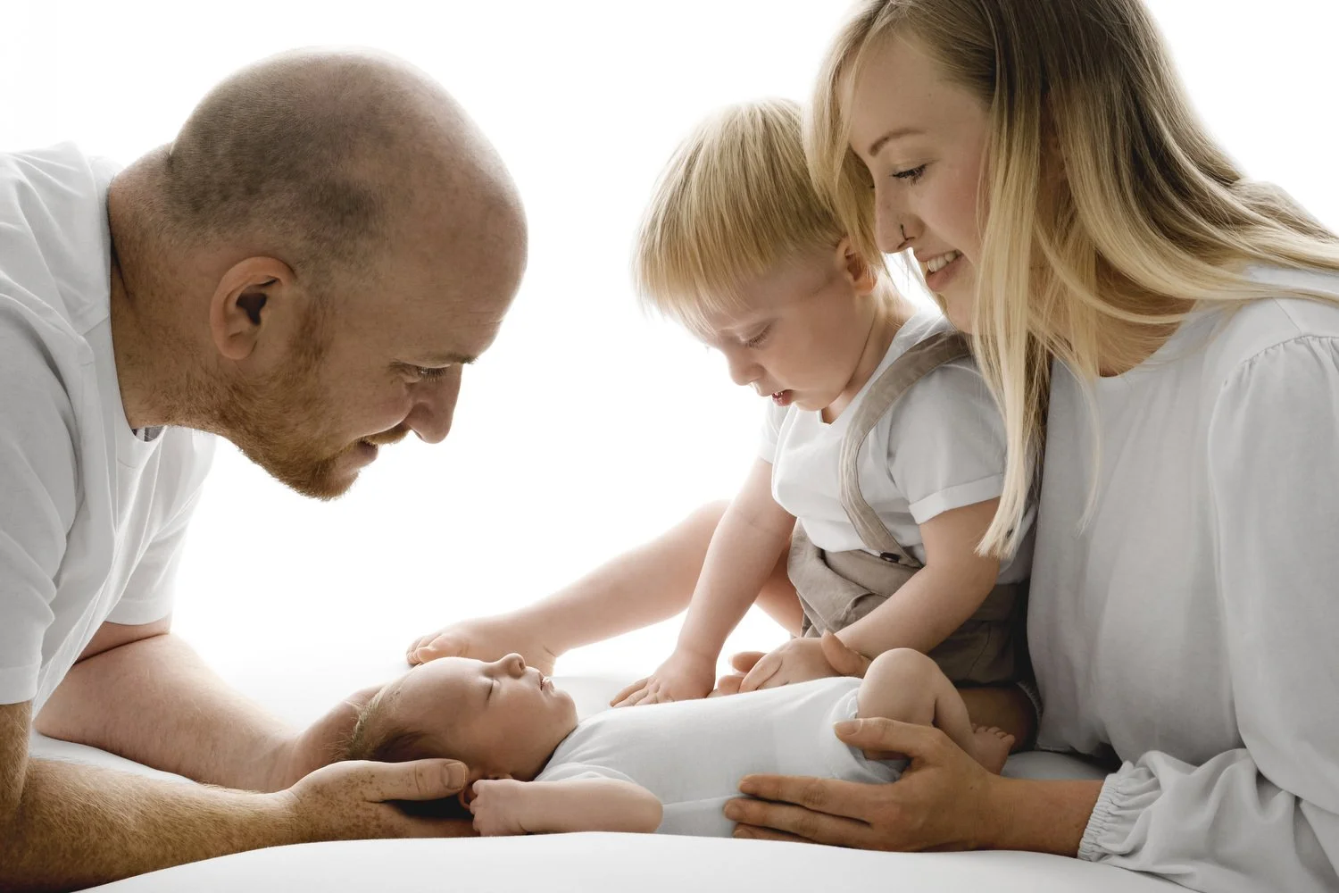 Family with newborn baby and toddler at Mabel and Moose studio Dundee