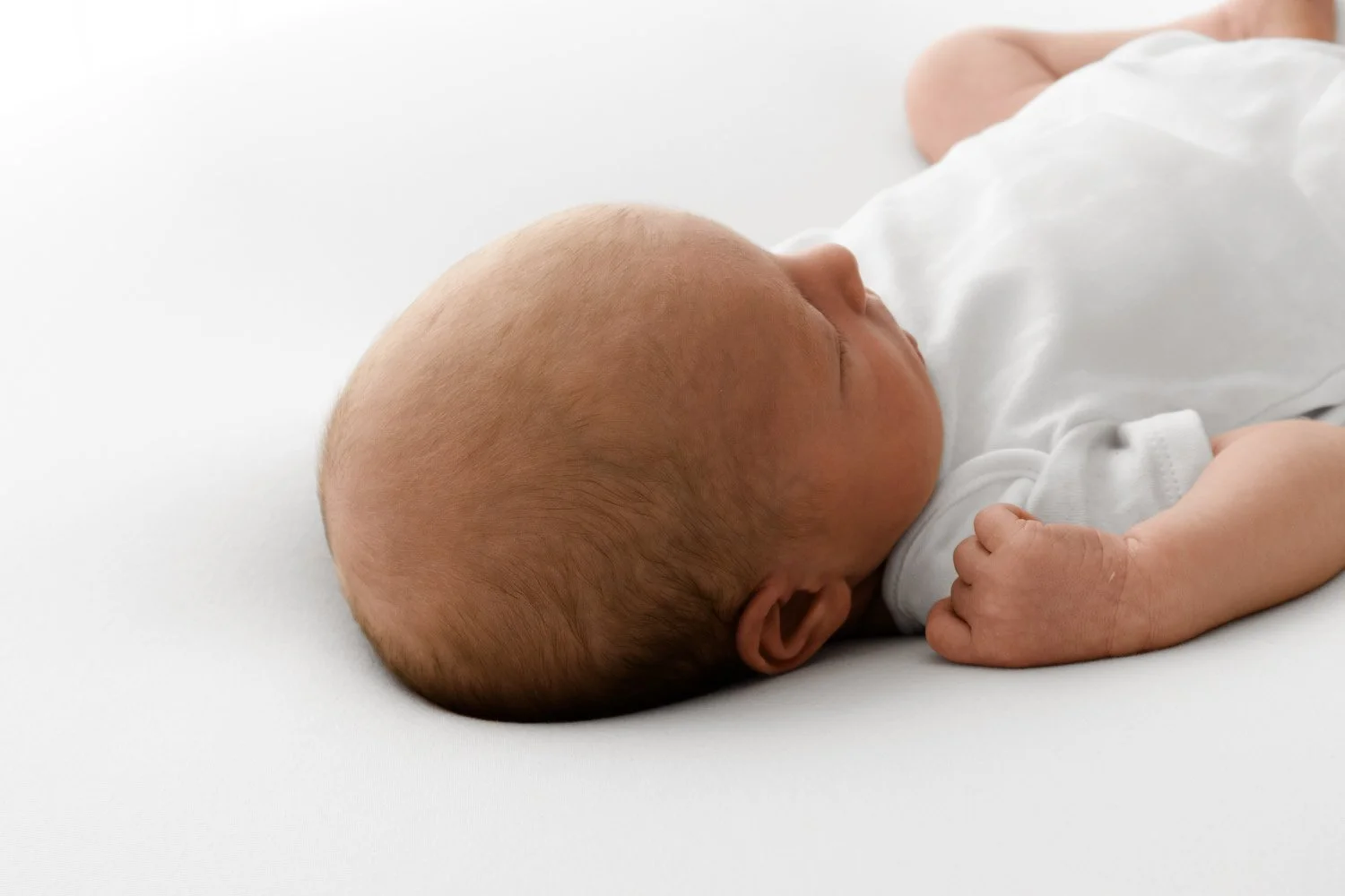 Bald newborn baby lifestyle portrait at Mabel and Moose studio Dundee