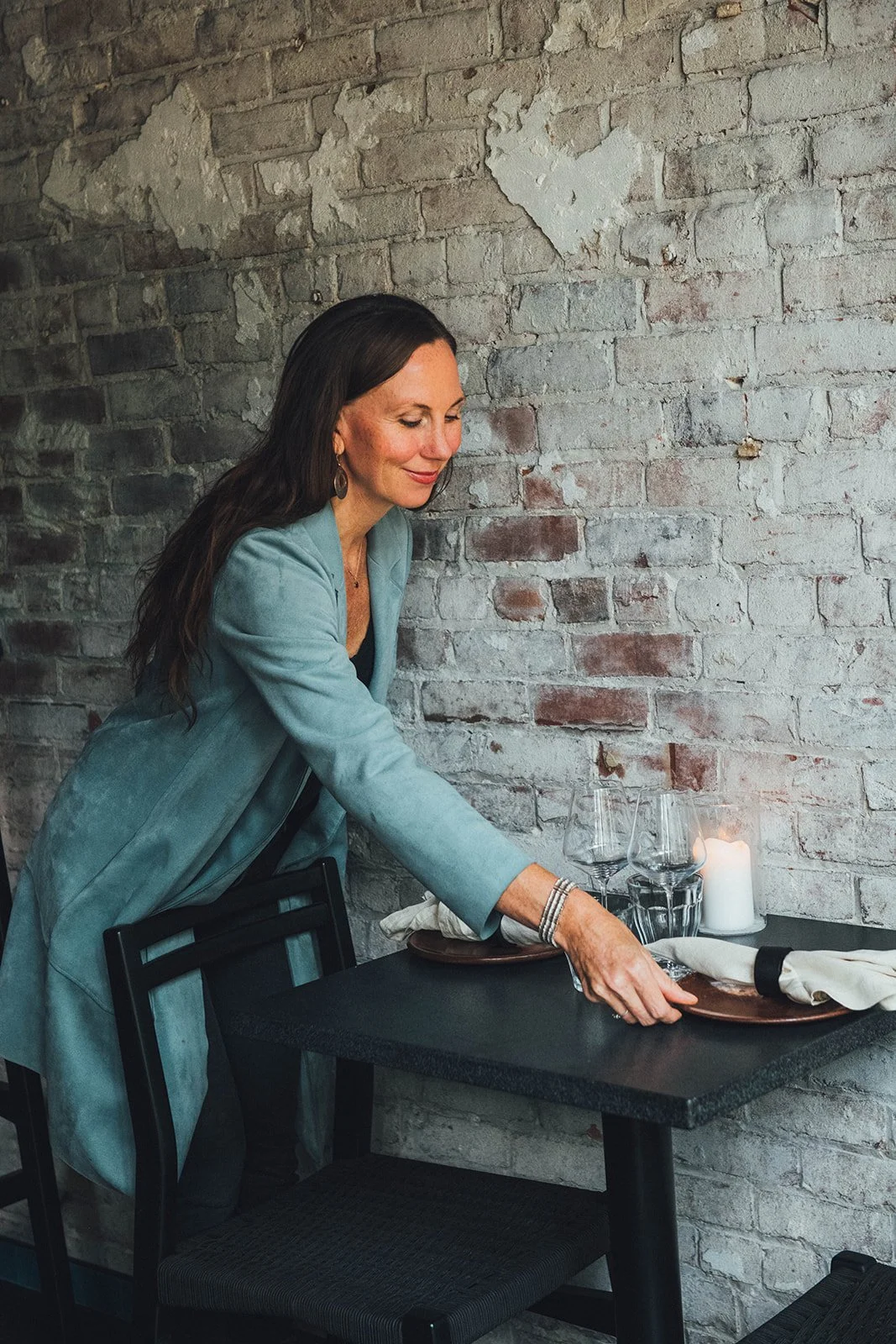  Lindsay Brennan puts the finishing touches on the room she helped bring to life. 