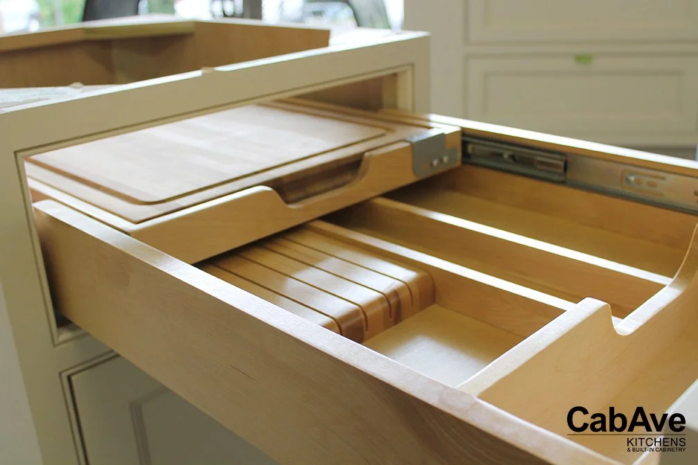 Wooden kitchen drawer with cutting board and dividers