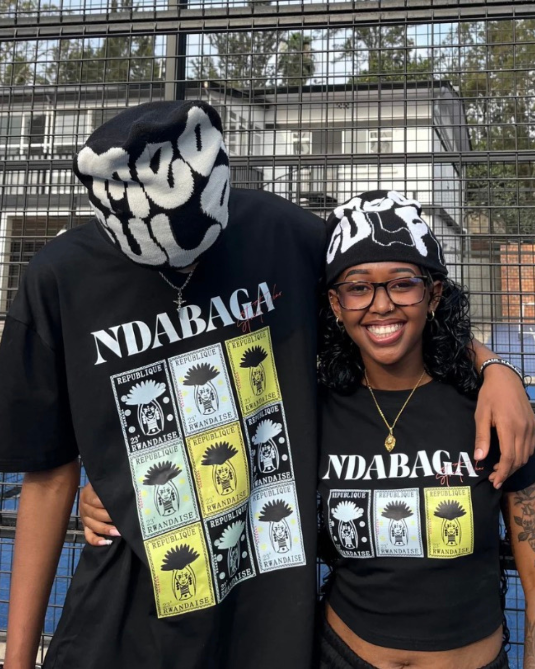 Male anf female models wearing the NDAGABA Multi-Stamps Tee