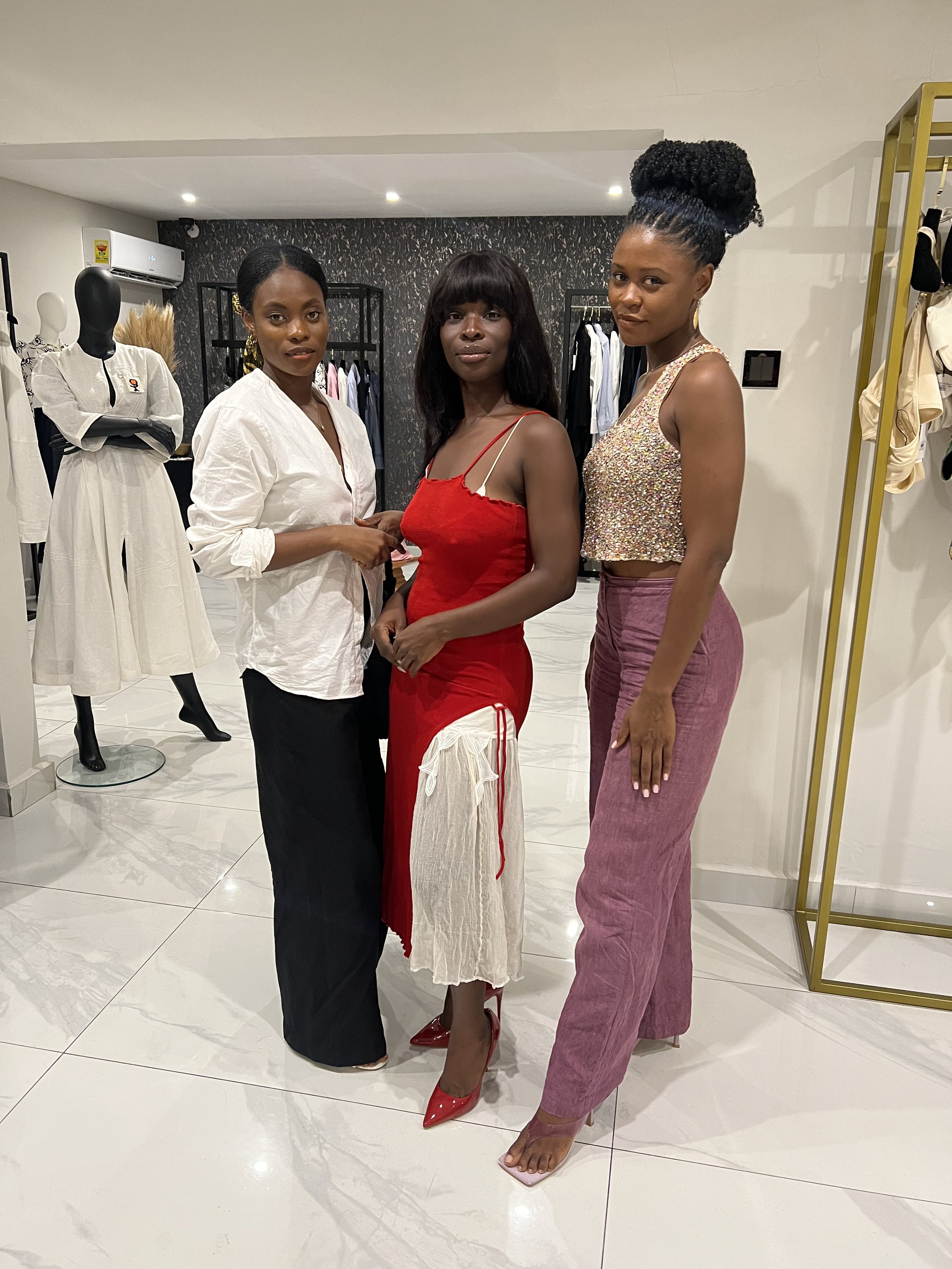 Chloe Asaam posing with two friends at the launch of the Asantii fashion brand in Accra, Ghana