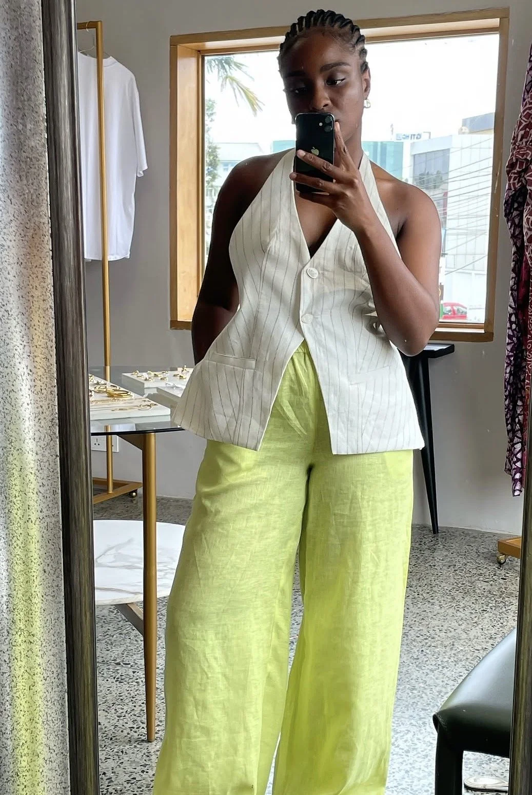 Baboa Tachie-Menson wearing an Ono open back vest in off-white and linen pants in lime green