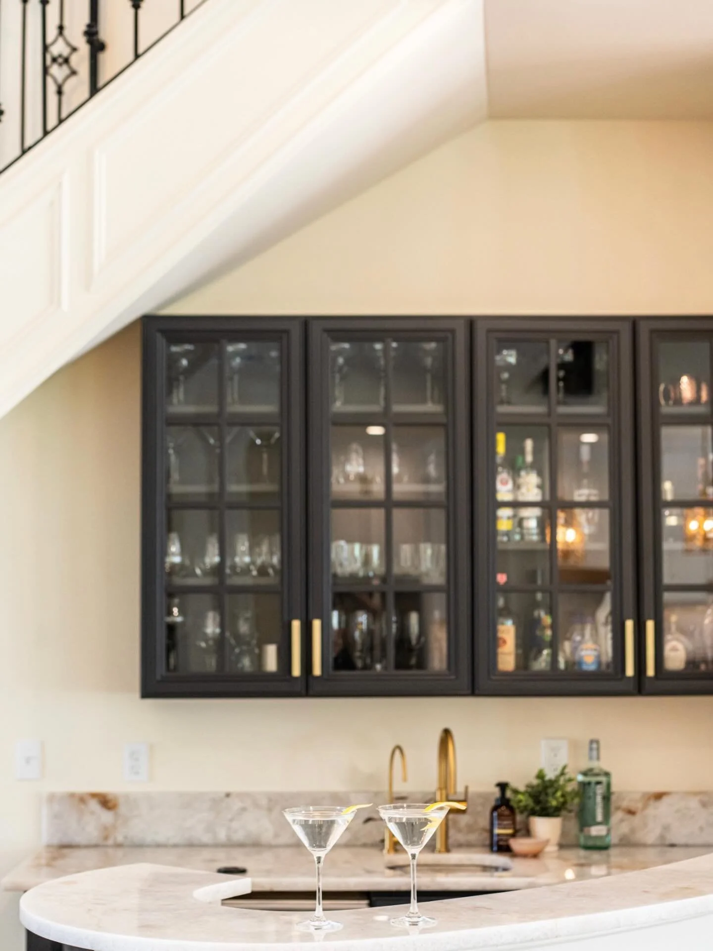 Moody, modern, and made for martinis.🍸 Brought this bar back to life with gorgeous Cristallo stone, bold color, warm finishes, and a little sparkle.✨ 

#homedesign #barrenovation #blairlancasterhomes #neworleansdesign