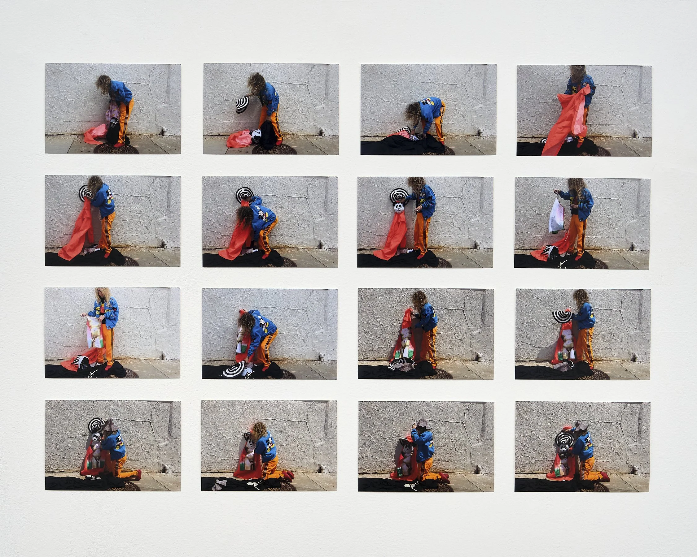 A sequence of photos showing a person with curly hair wearing a blue jacket and orange pants, interacting with various colorful items and objects against a plain white wall.