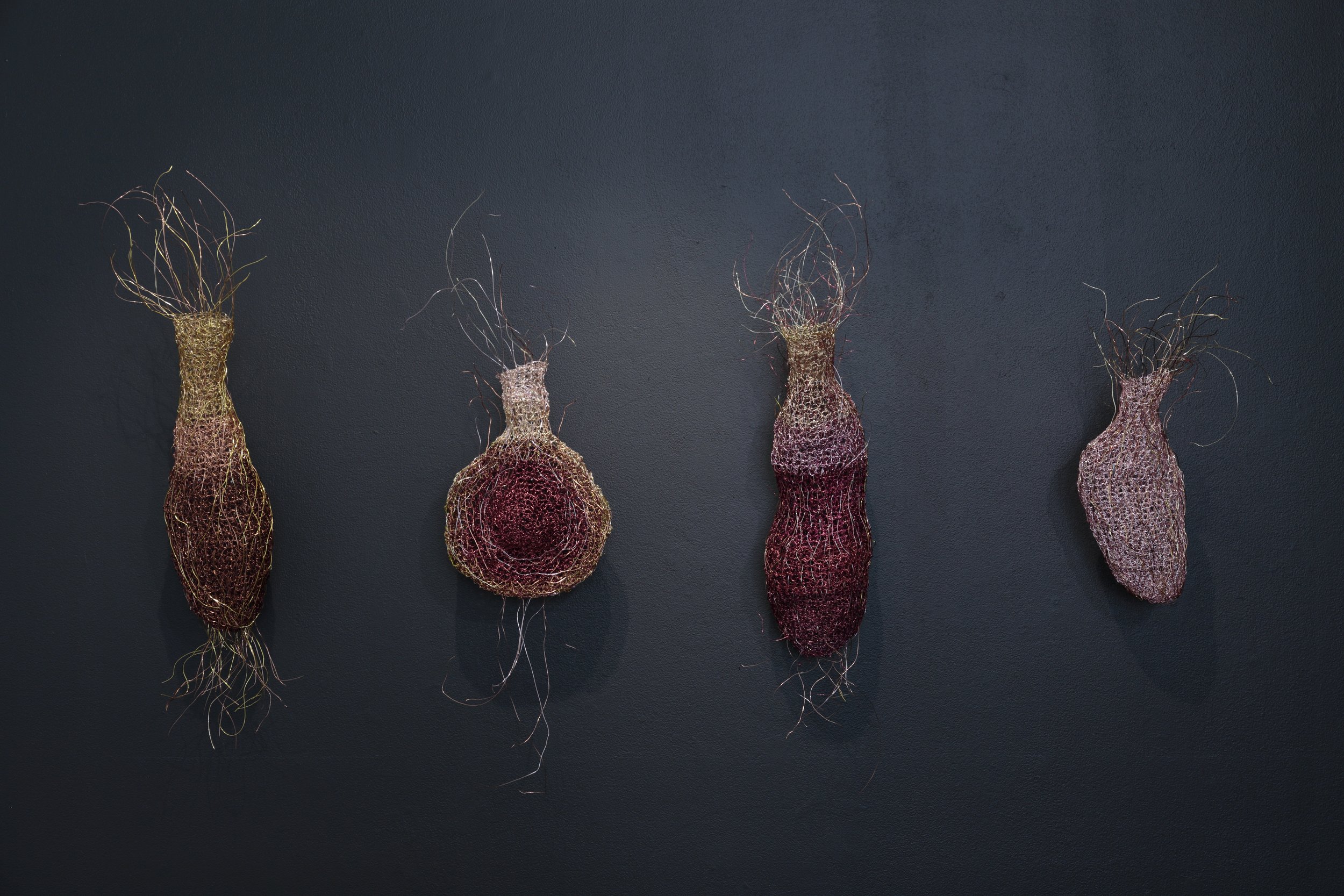 Naissance, 2022-2023. 
Crocheted recycled copper wire. Installation view, dimensions variable- approx H 550mm x W 1000mm. Strata, Lorne Sculpture Biennale 2025