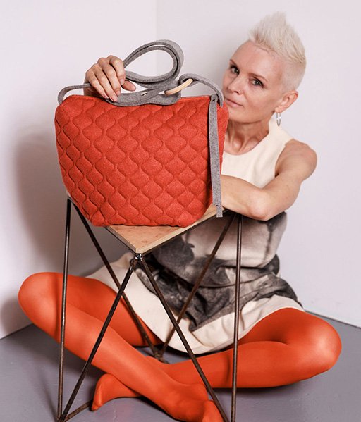 SarahLewis_FeltCulture_sitting orange bag.jpg