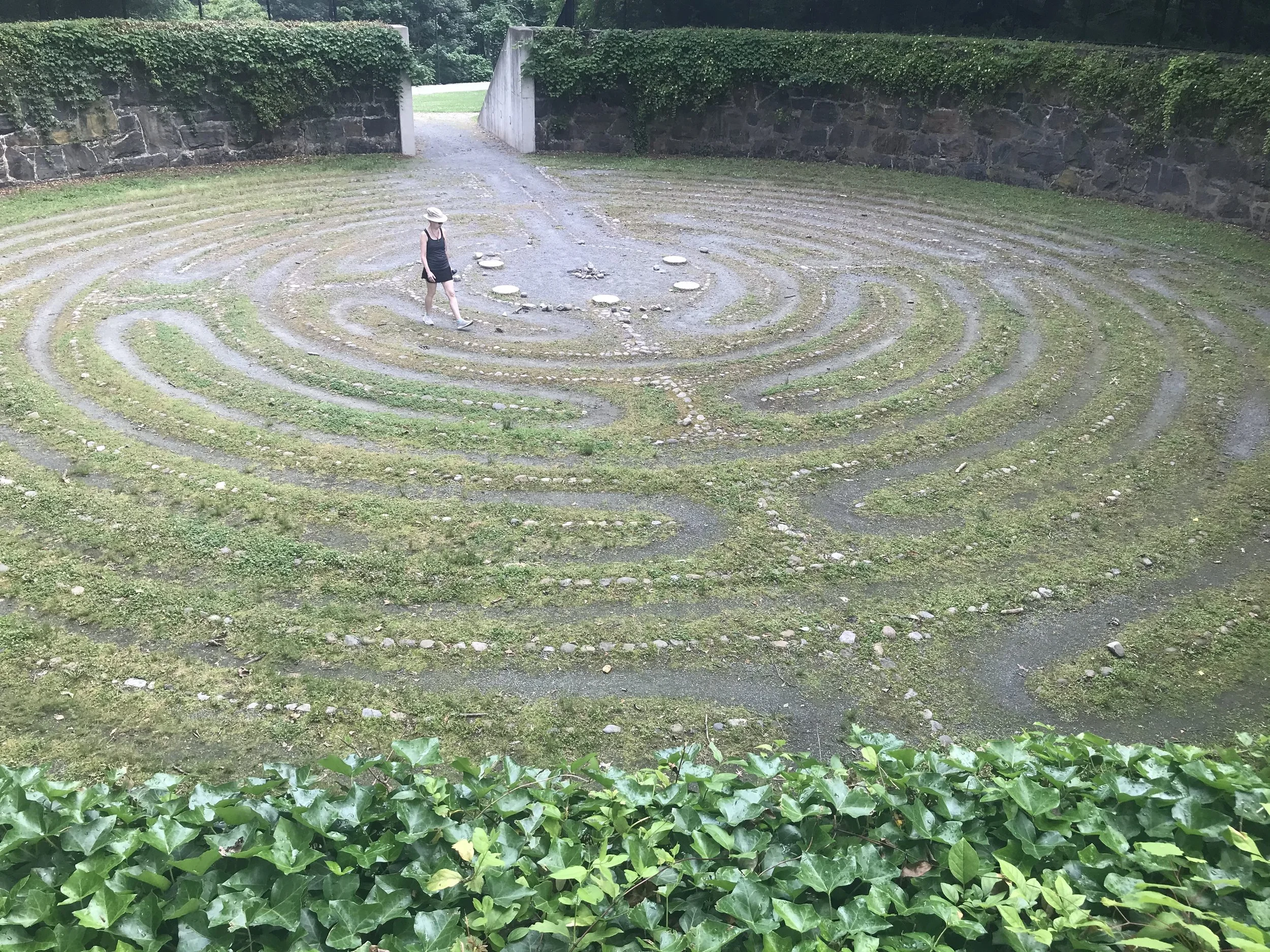 Artist Jenny Gallo walks the labyrinth behind the Delaware Art Museum in Wilmington, DE.