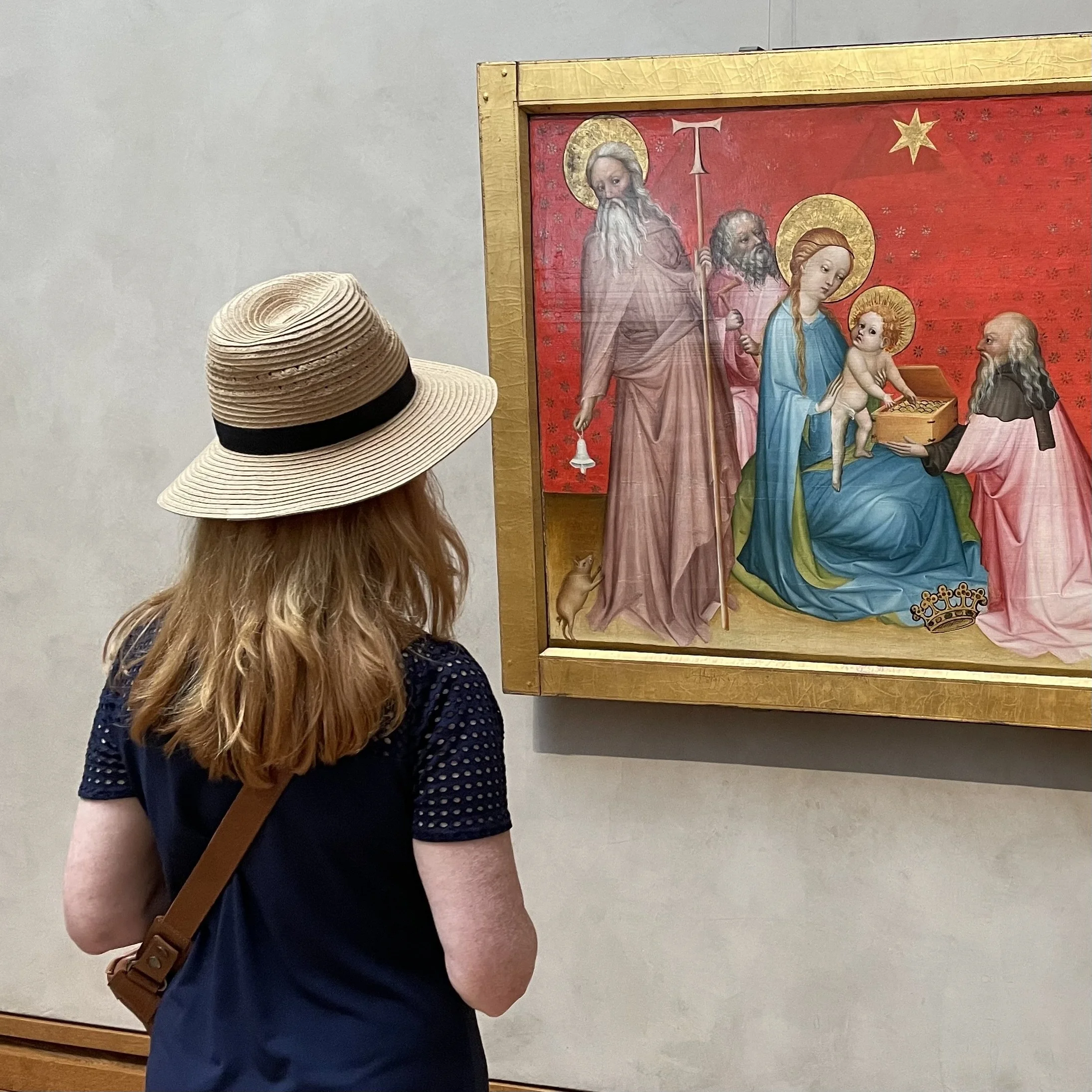 Artist Jenny Gallo observing Adoration of the Magi by an anonymous Franco-Flemish Master at the Getty Center.