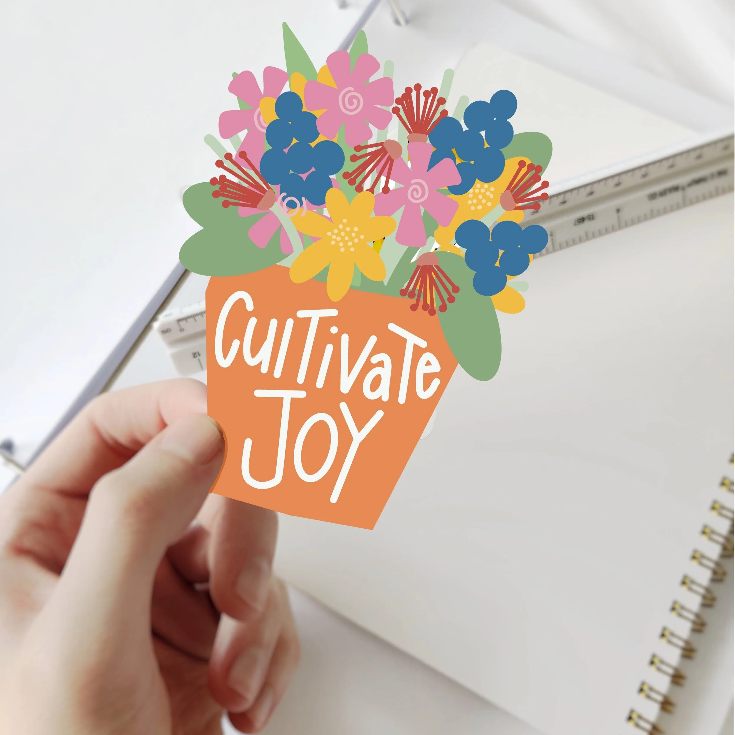 bright colored flowers in an orange pot that reads 'cultivate joy' makes this a cute and meaningful sticker by Carrot Top Studio