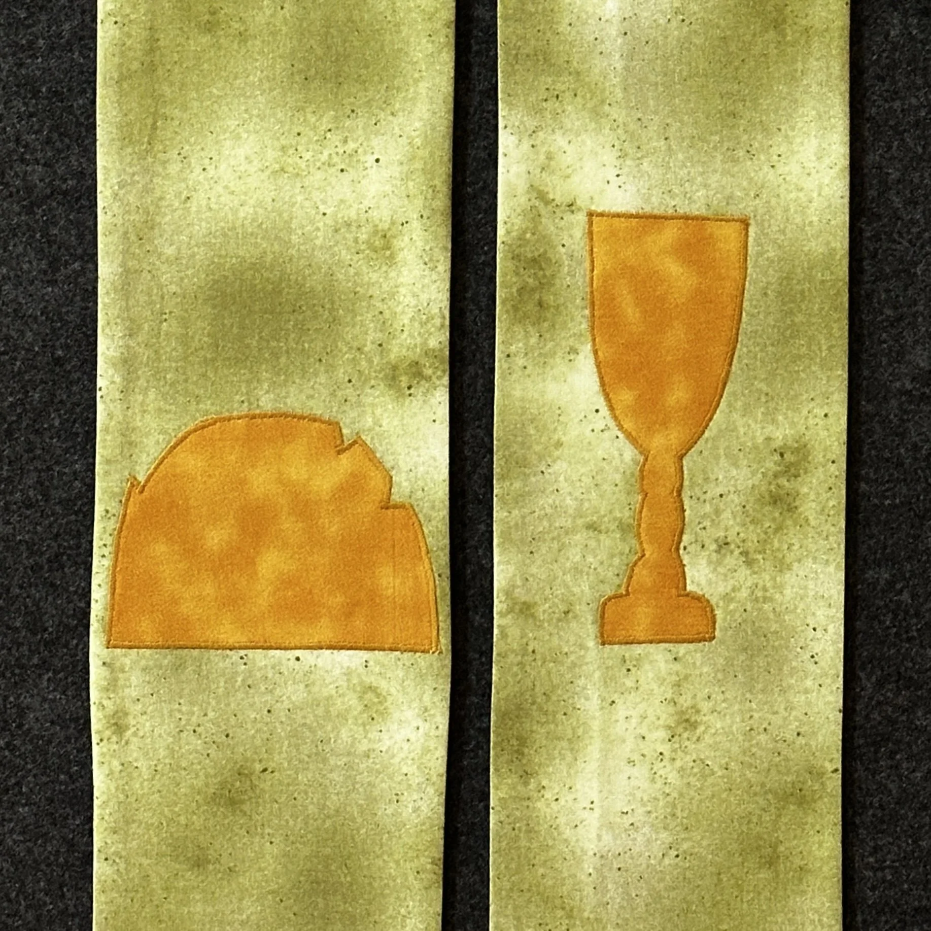 A detail of the green stole for Ordinary Time that celebrates Communion by Carrot Top Studio.