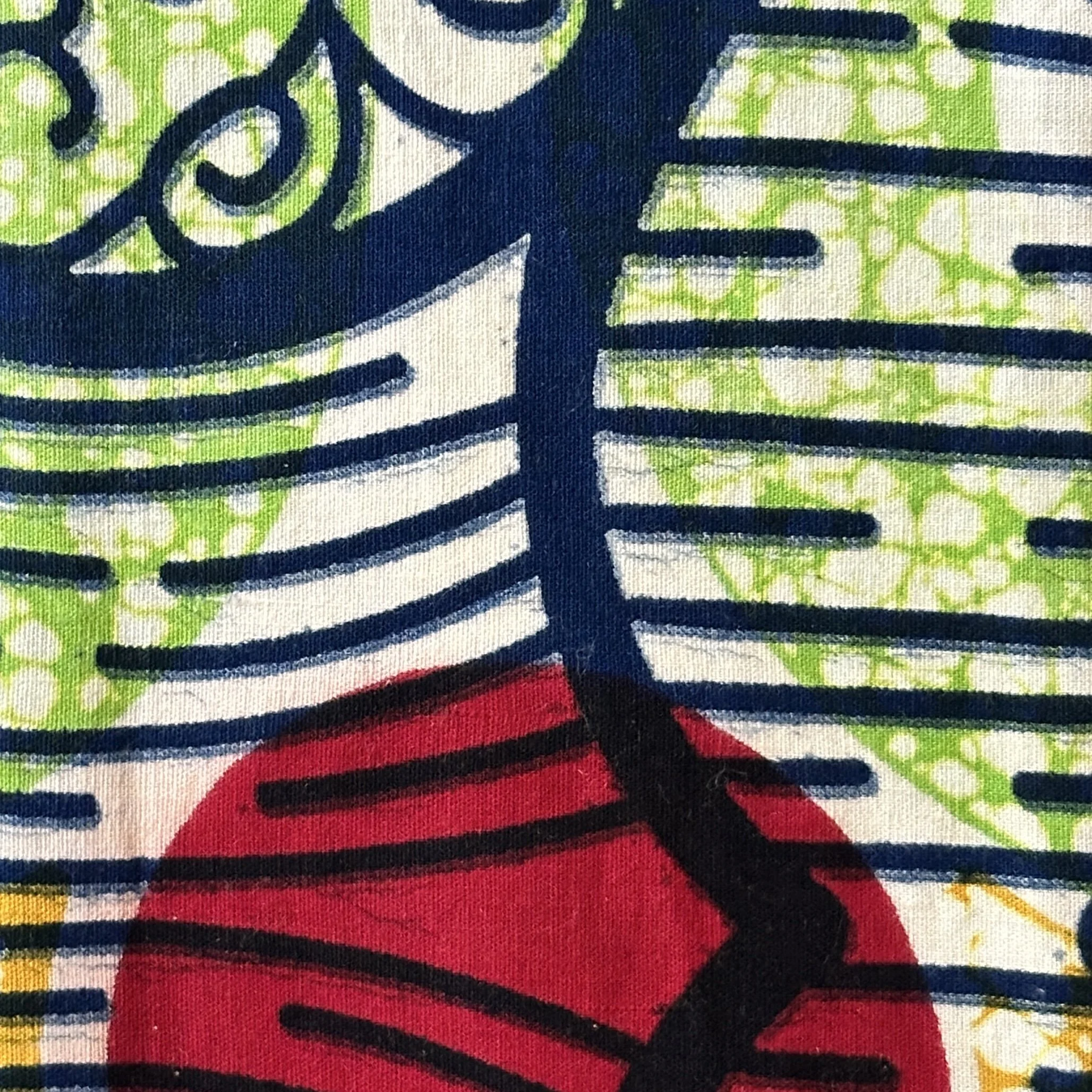 Detail of Afrocentric fabric used in a Communion stole. Find it in the Carrot Top Studio celebration clergy stole collection.