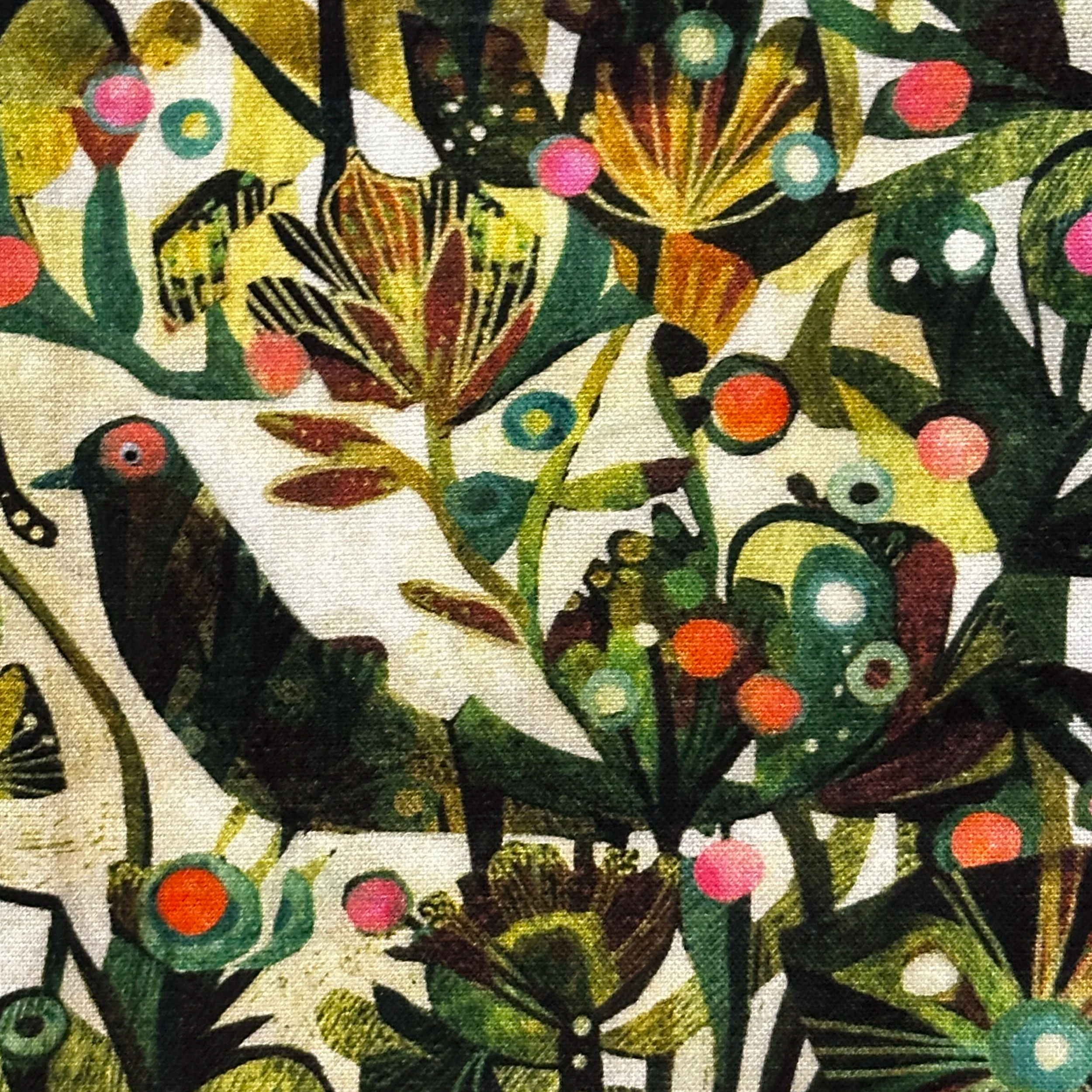 A detail of the border of a green Ordinary Time stole by Carrot Top Studio highlights a bird and plants.