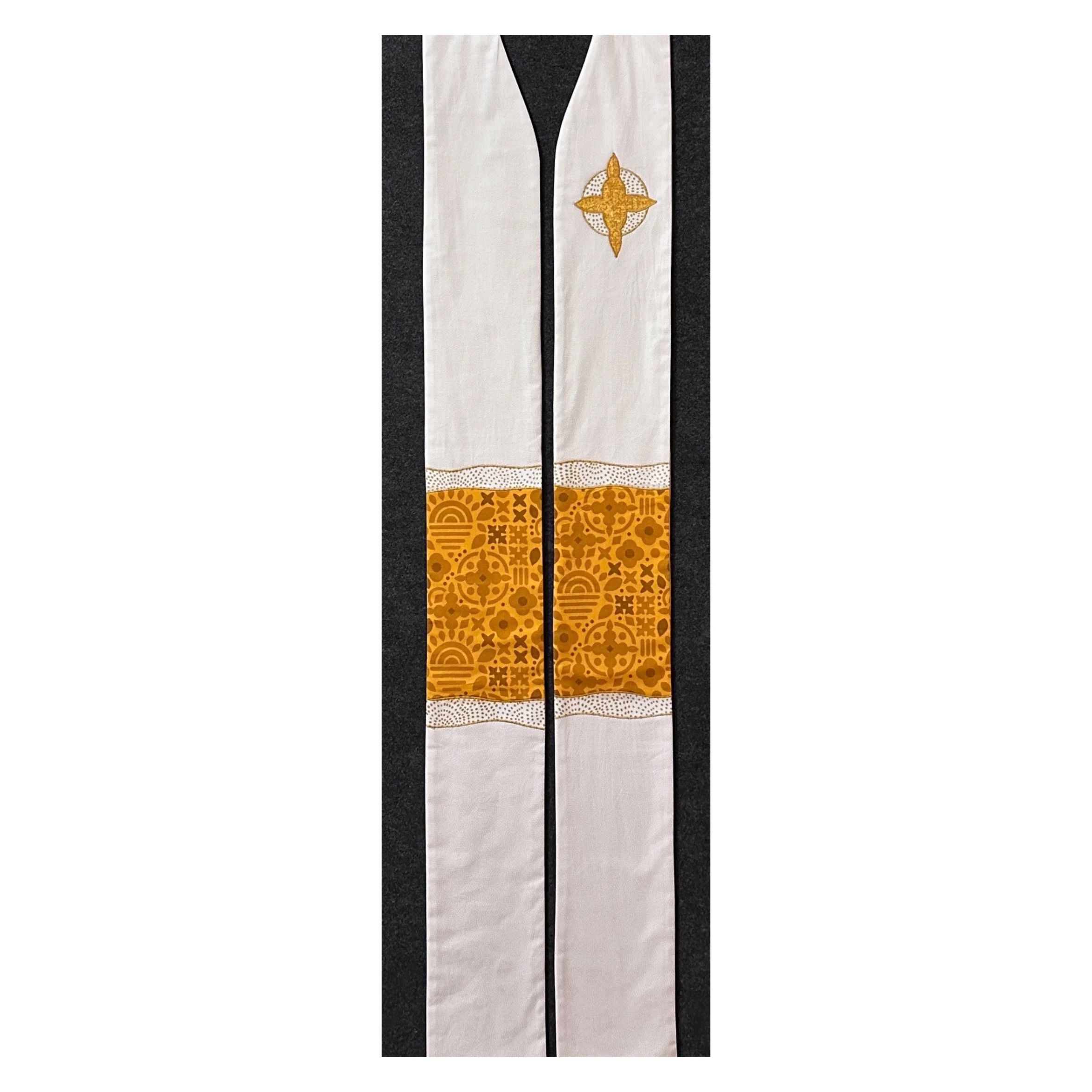 Shop Carrot Top Studio stoles. This is a white Christmas stole with gold folk art border and cross motif—symbols of light, life, and Christ’s radiant presence.