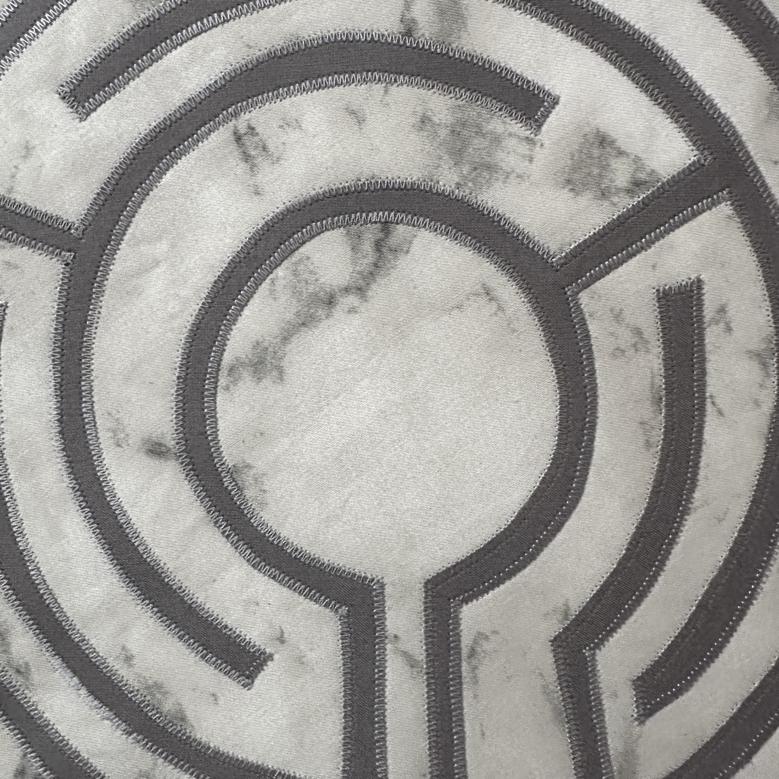 Portable 13-inch fabric finger labyrinth for tabletop use. Grey labyrinth on a light grey marbled background, perfect for prayer, meditation, and mindful travel.
