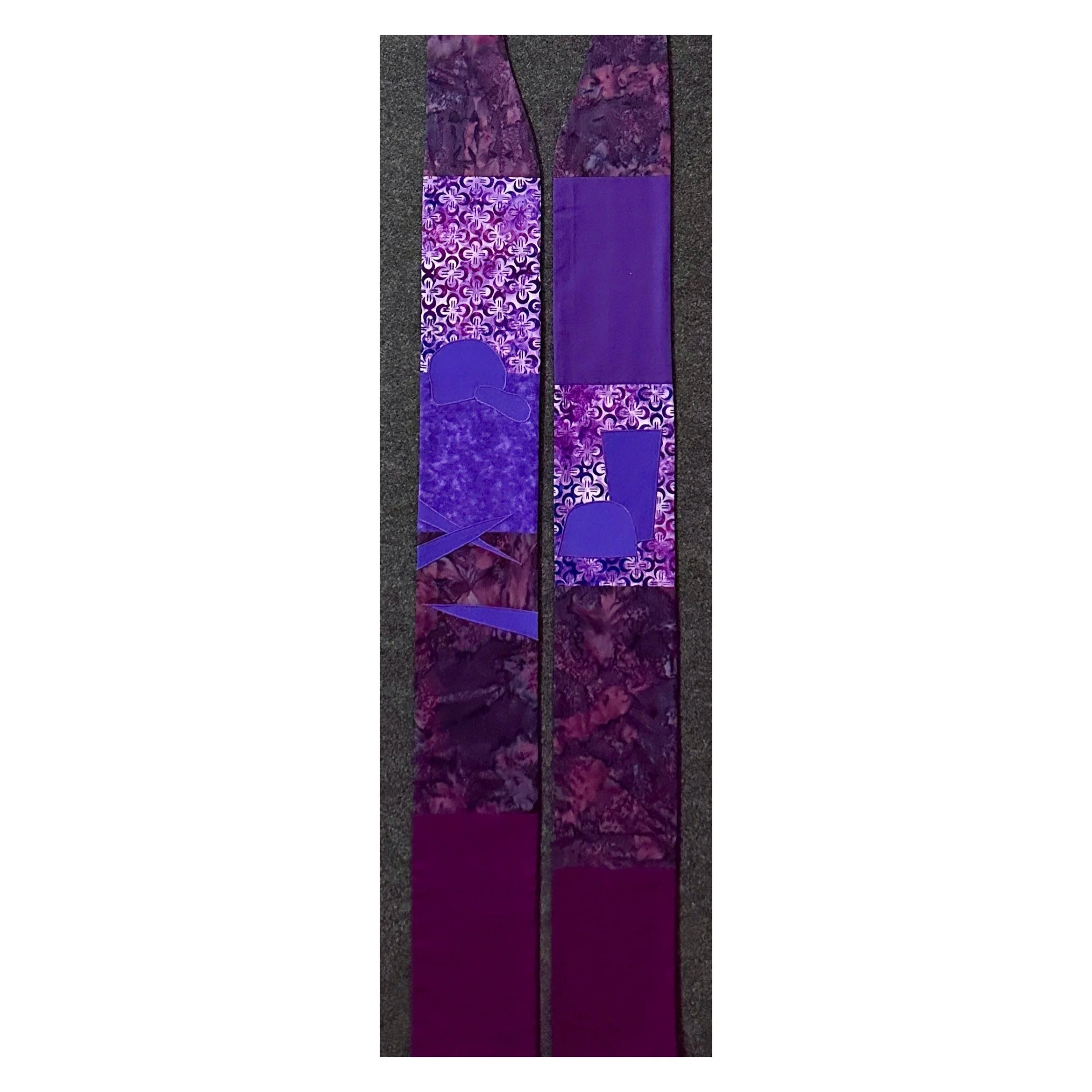 Handcrafted purple Lent stole symbolizing the journey toward Easter with wilderness stones, palms, and Communion imagery.