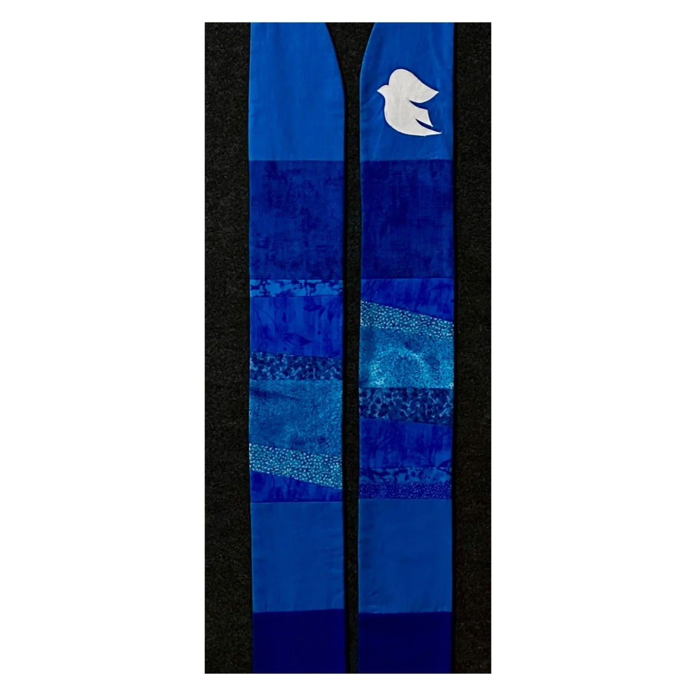 A blue advent clergy stole with peace dove by carrot top studio.
