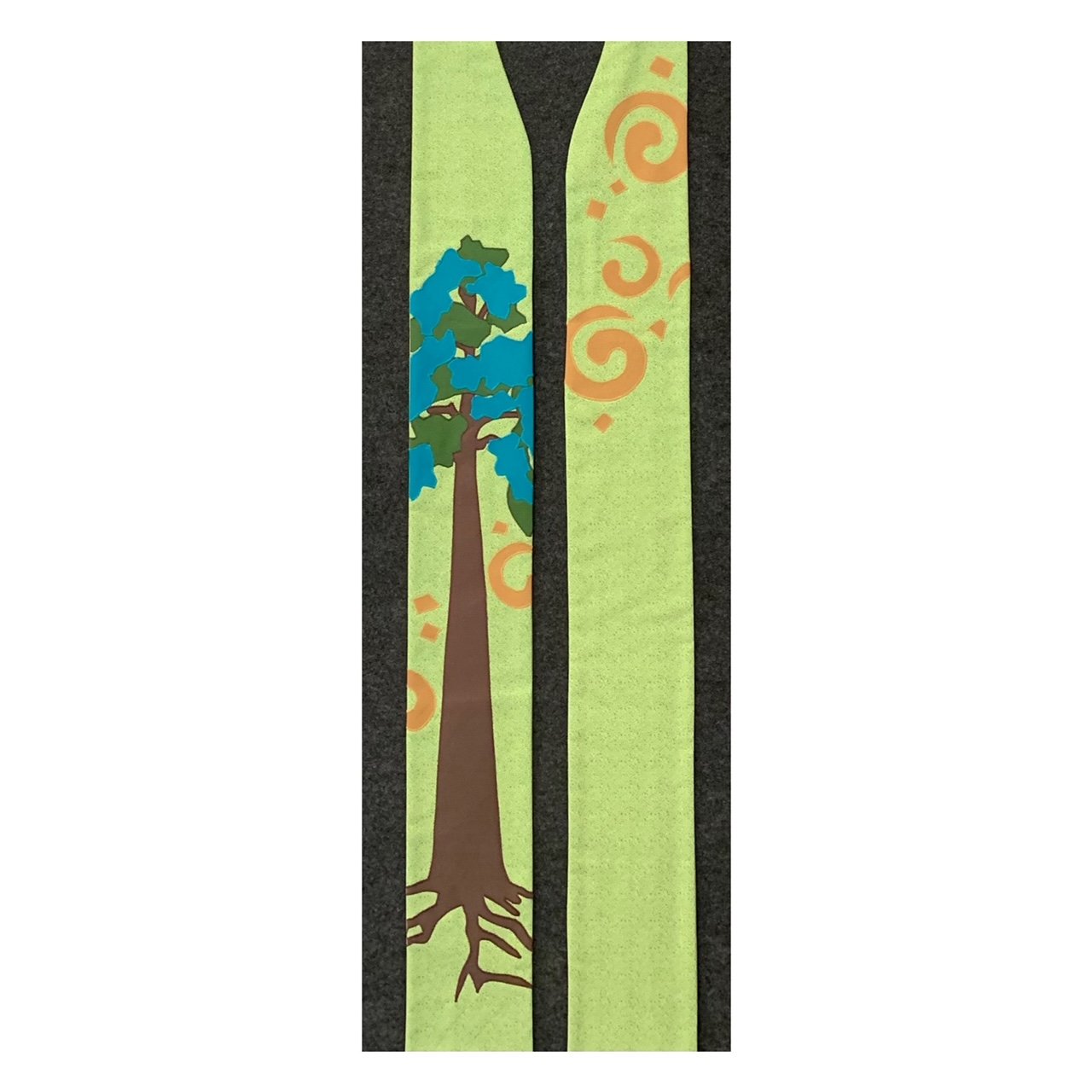 A one of a kind green clergy stoles commissioned and created by Carrot Top Studio with a tree and roots.