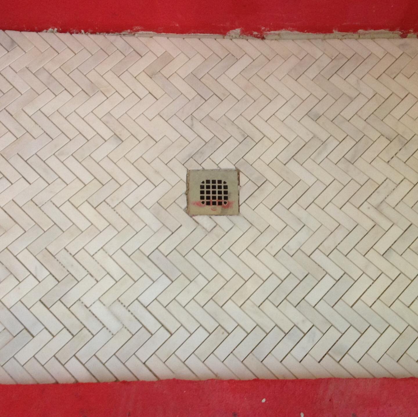 Marble herringbone tile install #classictile #bathroomdesign #gtacontractor