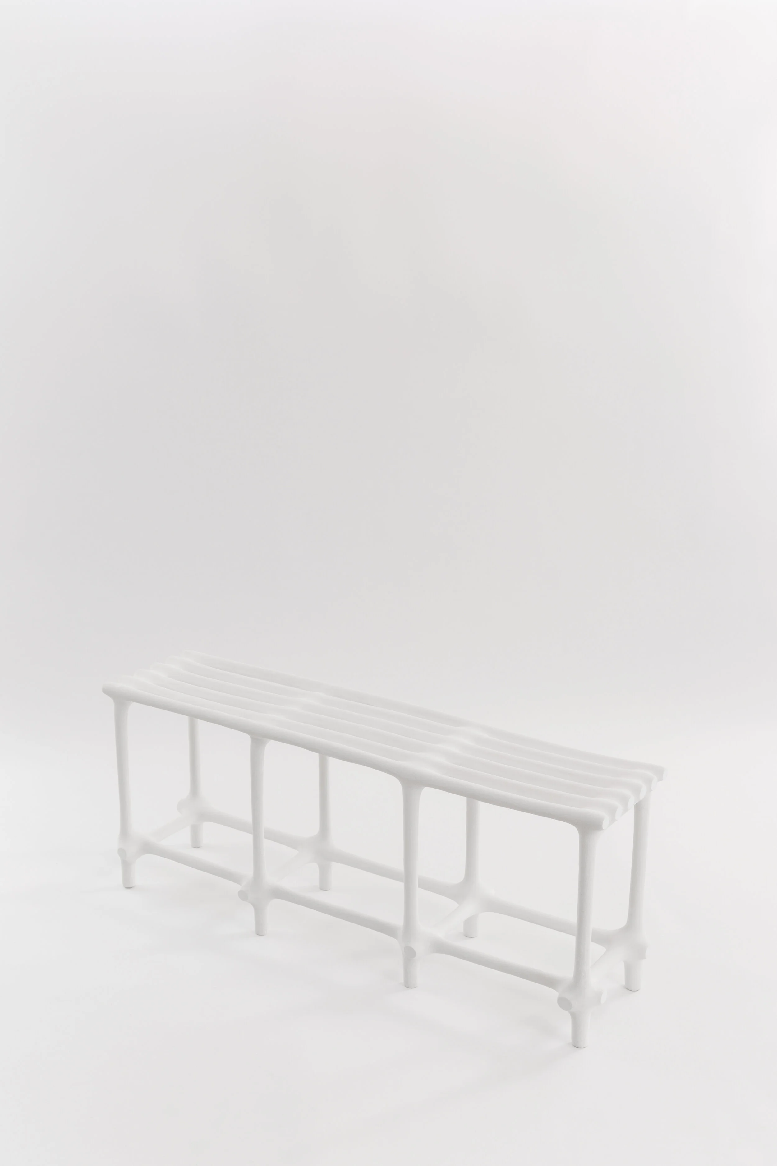 Hot Wire Extensions' Basic Bench. A three seater bench finished with polyurea in white