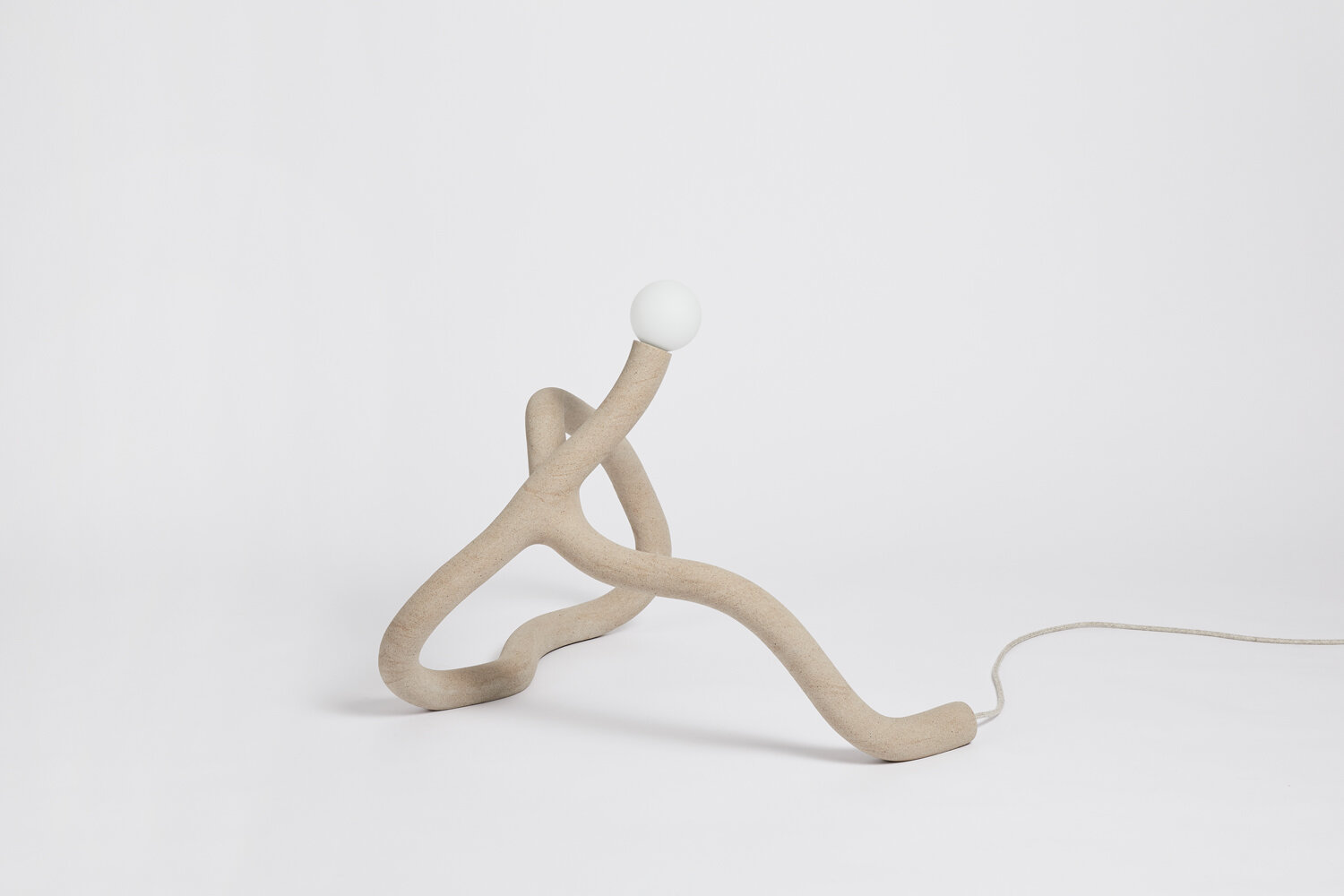 Hot Wire Extensions' Native Light 2. A floor light with natural textile cable and a raw, sealed finish