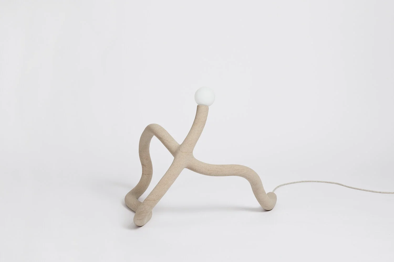 Hot Wire Extensions' Native Light 2. A floor light with natural textile cable and a raw, sealed finish