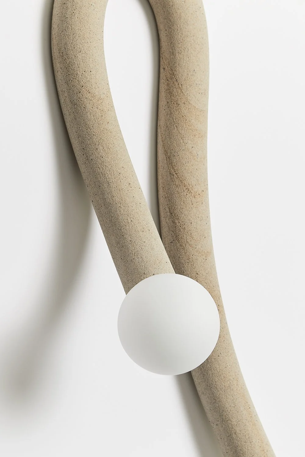 Hot Wire Extensions Native Light 11. A wall mounted light with natural textile cable and a raw, sealed finish