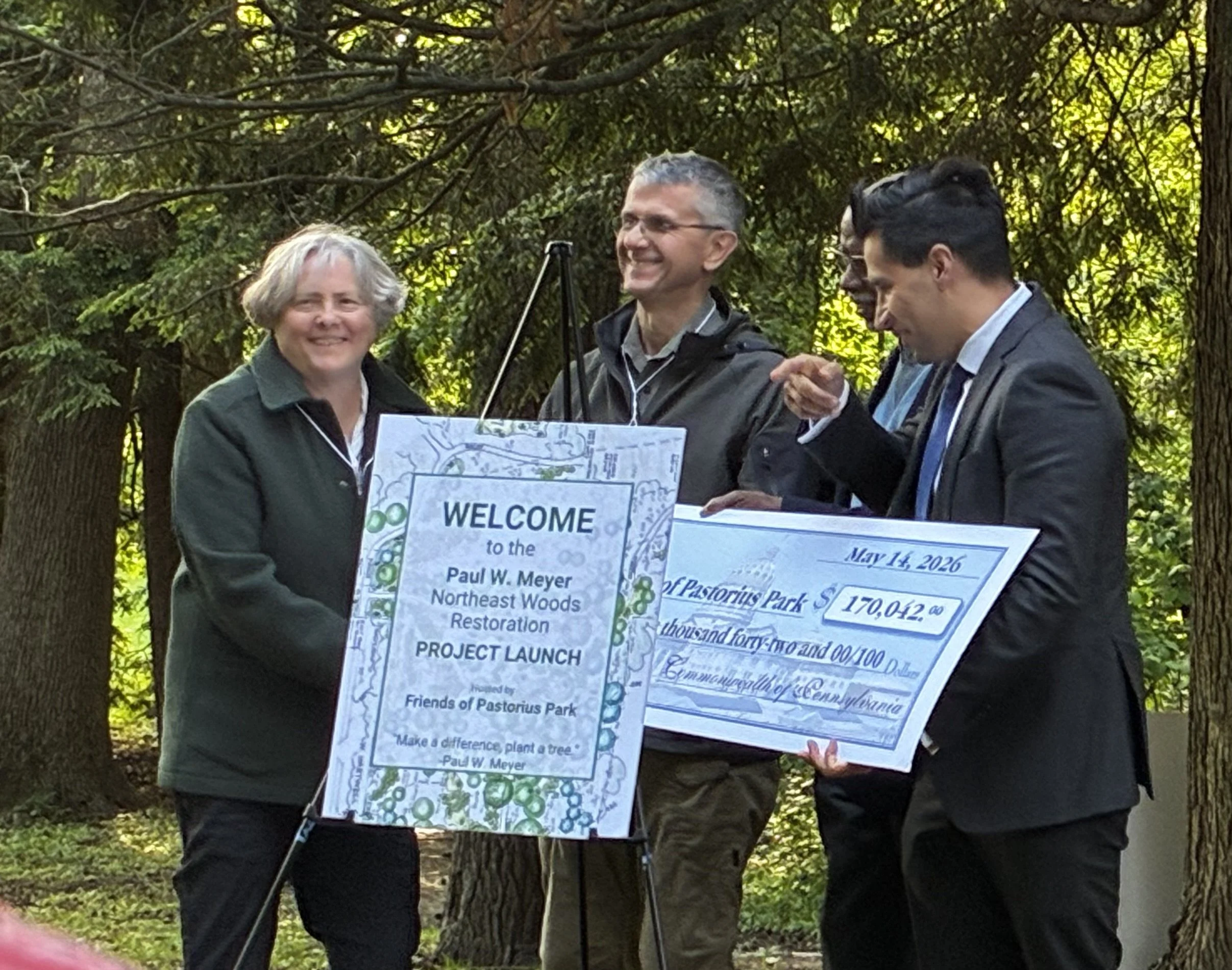 PA State Senator Art Haywood and State Representative Tarik Khan, presenting the Friends of Pastorius Park with the grant check on behalf of the Department of Environmental Protection "Growing Greener" Program.