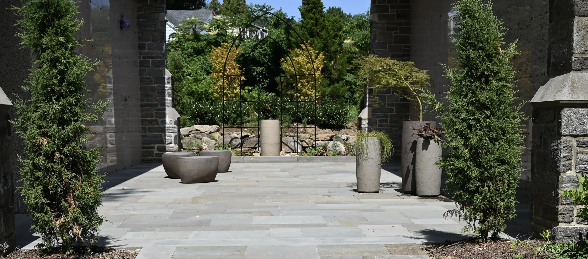 The courtyard fountain with matching planters and benches.