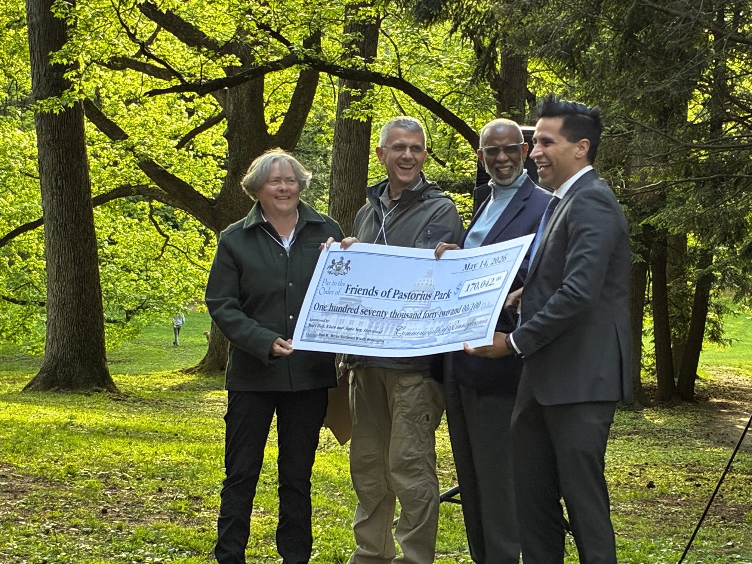 PA State Senator Art Haywood and State Representative Tarik Khan, presenting the Friends of Pastorius Park with the grant check on behalf of the Department of Environmental Protection "Growing Greener" Program.