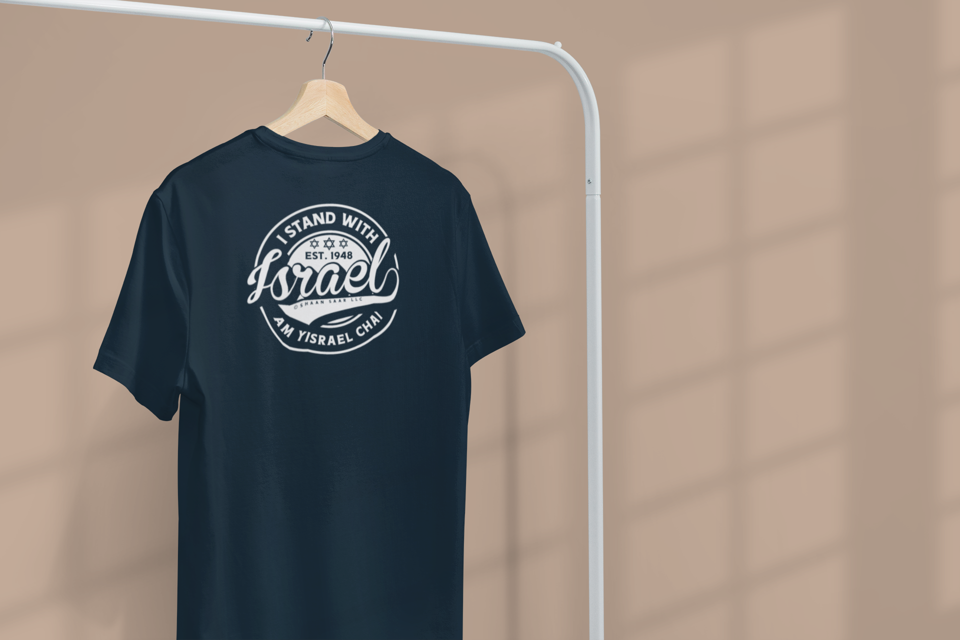 minimal-apparel-mockup-featuring-a-customizable-t-shirt-hanging-from-a-clothing-rack-3733-el1.png