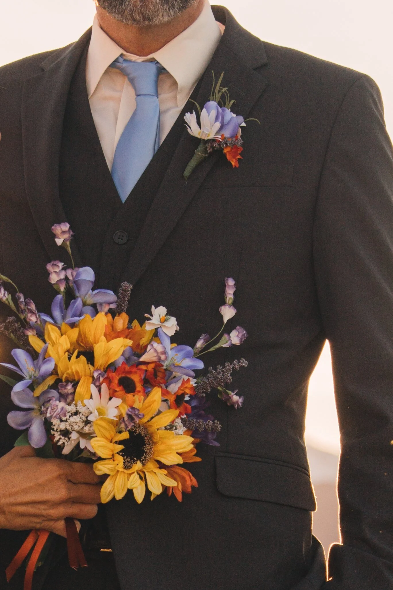  Experience the pure bliss of a wedding day where love knows no bounds. This enchanting image showcases a radiant bride and groom, surrounded by the warmth of their loving family. The air is filled with love and joy as they exchange vows, creating un