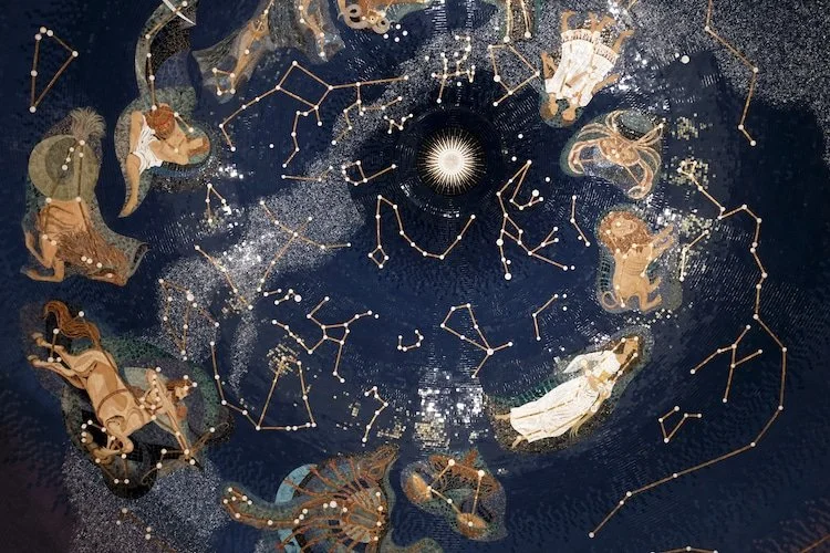Illustrations of the zodiac from another artist, swirling in a night sky circle with constellations mapped out on top of them.  from Pavel Malitskyi/Shutterstock