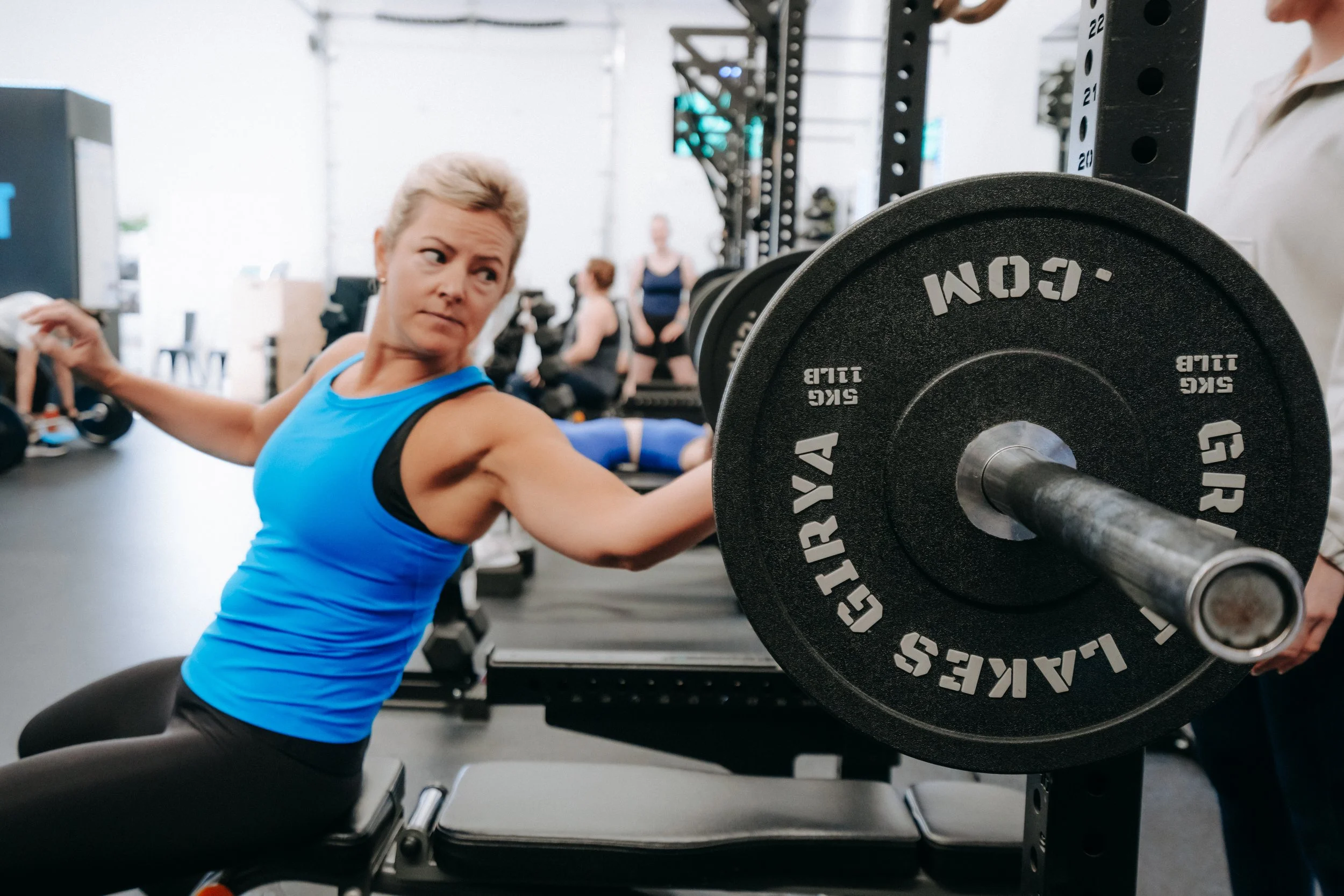 Jolt Fitness member exercising bench press pattern for upperbody strength