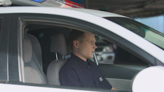 police-officer-in-car-using-walkie-talkie-dispatc-2021-09-02-18-01-07-utc_AdobeExpress.gif