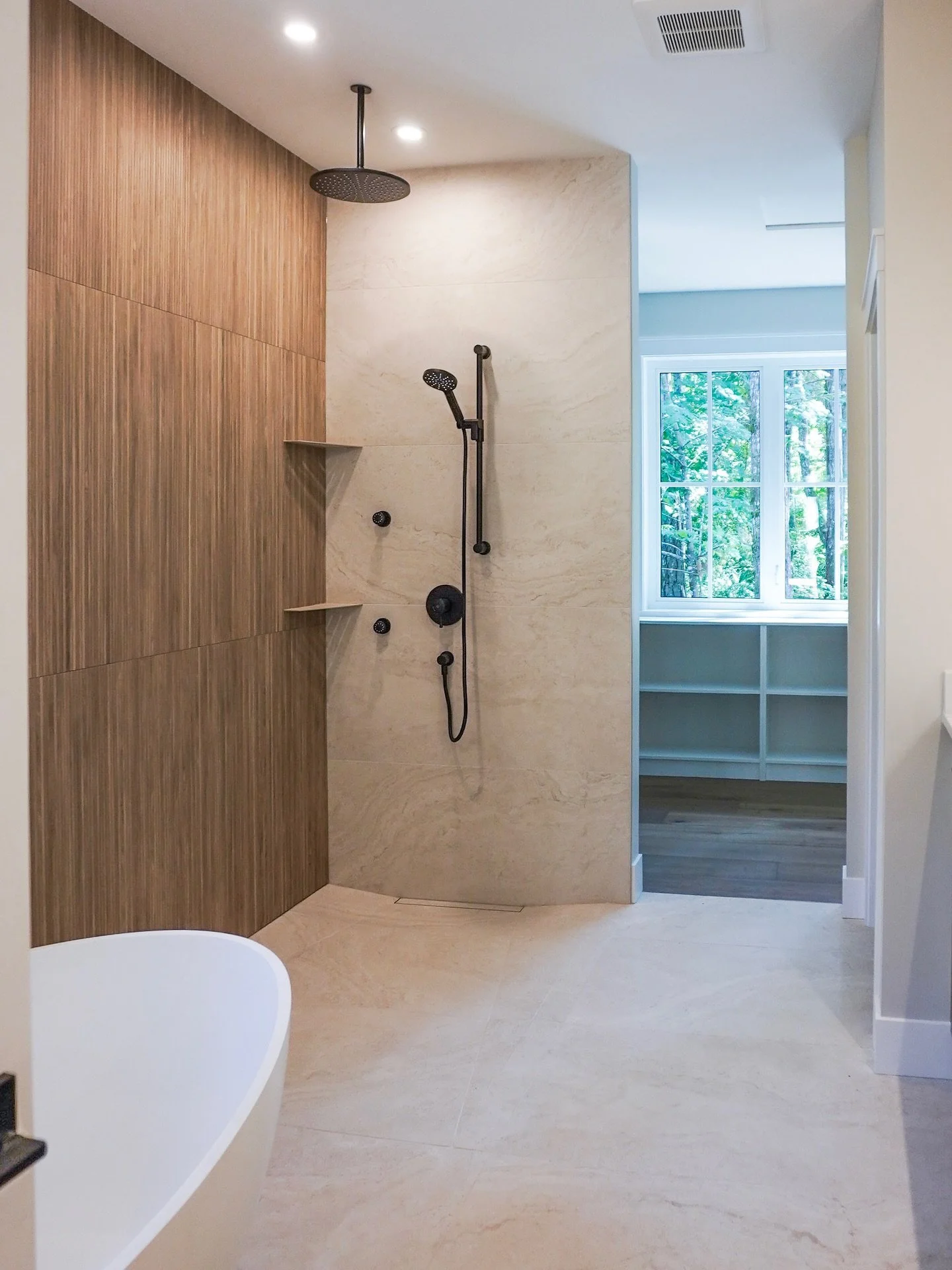 A primary bath that ticks all of the boxes!

Have a look at the tile work in this curbless shower &mdash; seamless entry and a removable, linear drain make keeping this space clean a breeze!