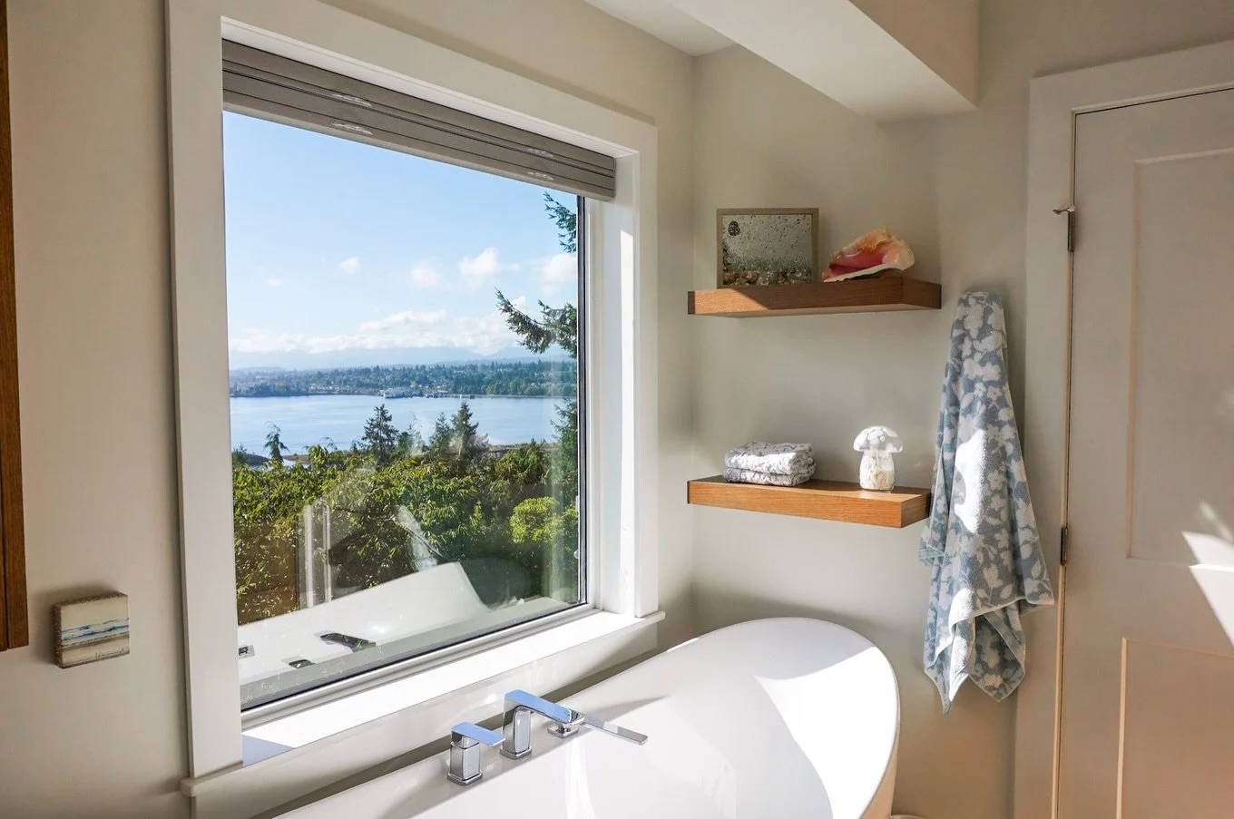 Another couple from this sweet reno! Some of our favourite additions?

The view, of course! We added this large window overlooking Departure Bay!

Our team also installed these awesome floating shelves to display all of our clients beautiful keepsake