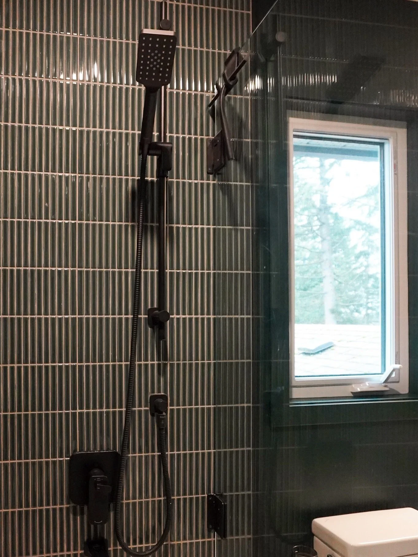 The colour drenched bathroom that never gets old &mdash; this one is all mood and we think the half glass instead of a shower curtain really adds a lot of visual space and an element of luxury that is sometimes hard to find in a standard sized bathro
