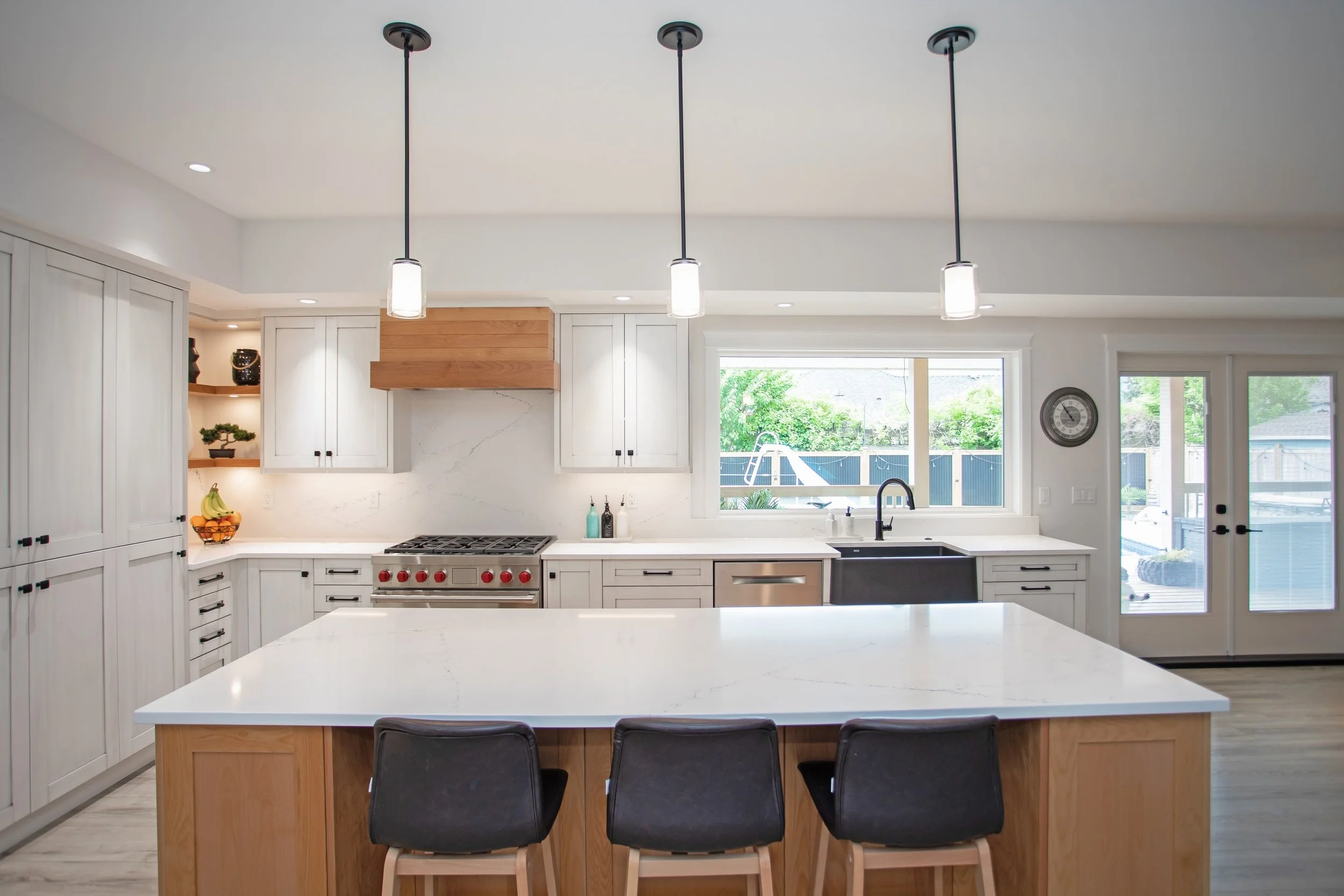 Features like this custom hood vent and open corner shelving are what set your space apart.

Simple additions to a classic space help create that zhuzh you&rsquo;re looking for in a custom home..