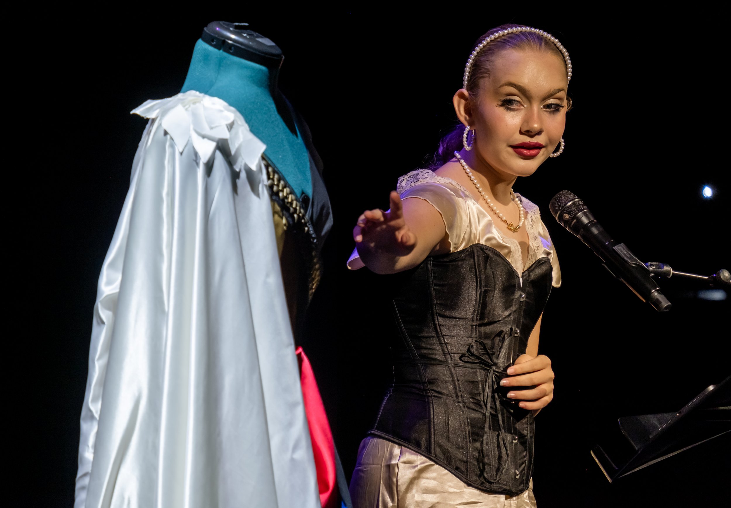  HEART Youth Arts Residency fashion designer Sage Duplechain presented “Glorious Contrast,” a dress she created to illustrate how darkness keeps us from experiencing the light.  