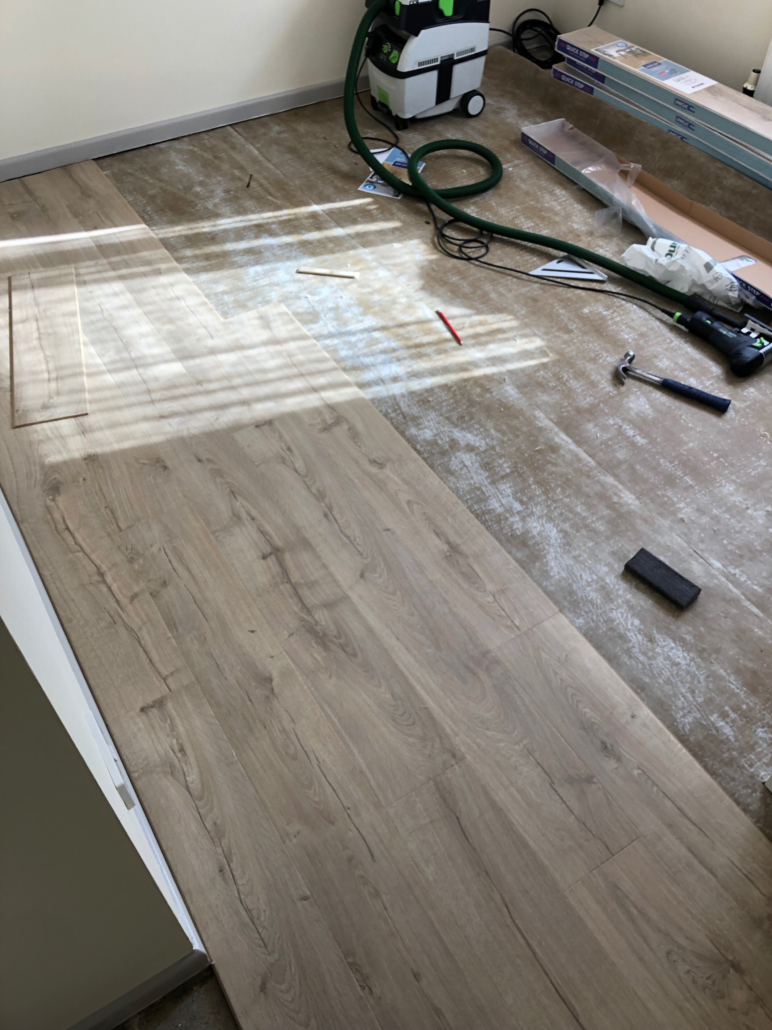 Quick-Step laminate flooring fitted to bedroom - A.T. Flooring - Swanage, Dorset.