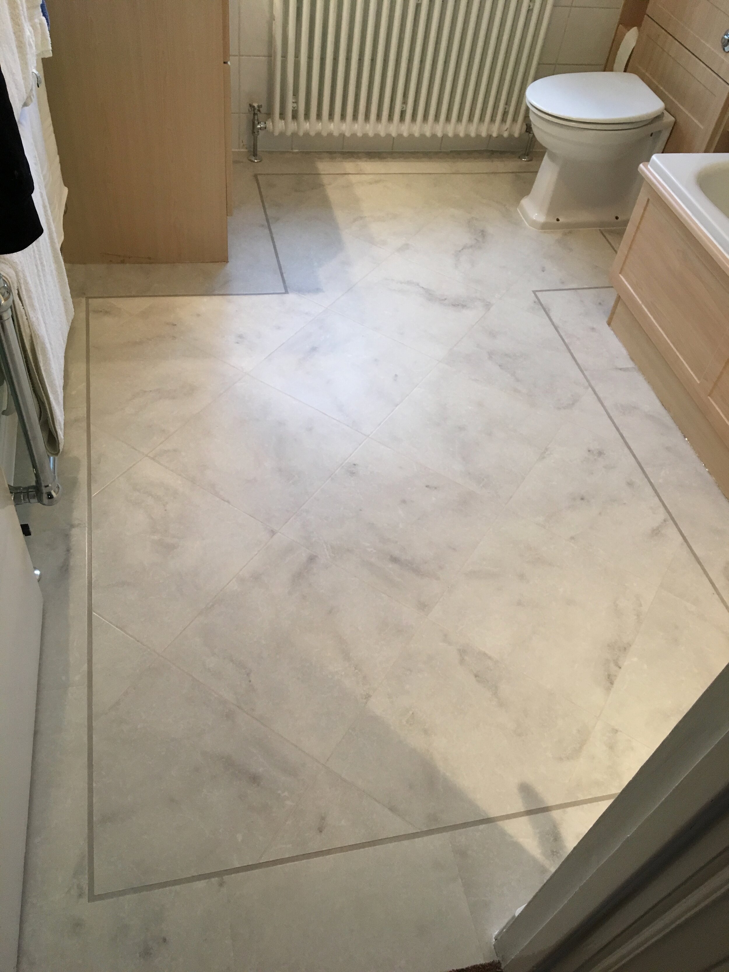 Amtico LVT (luxury vinyl tile) - tiles - straight lay, with a feature strip and border - Kitchen. - A.T. Flooring - Swanage, Dorset.