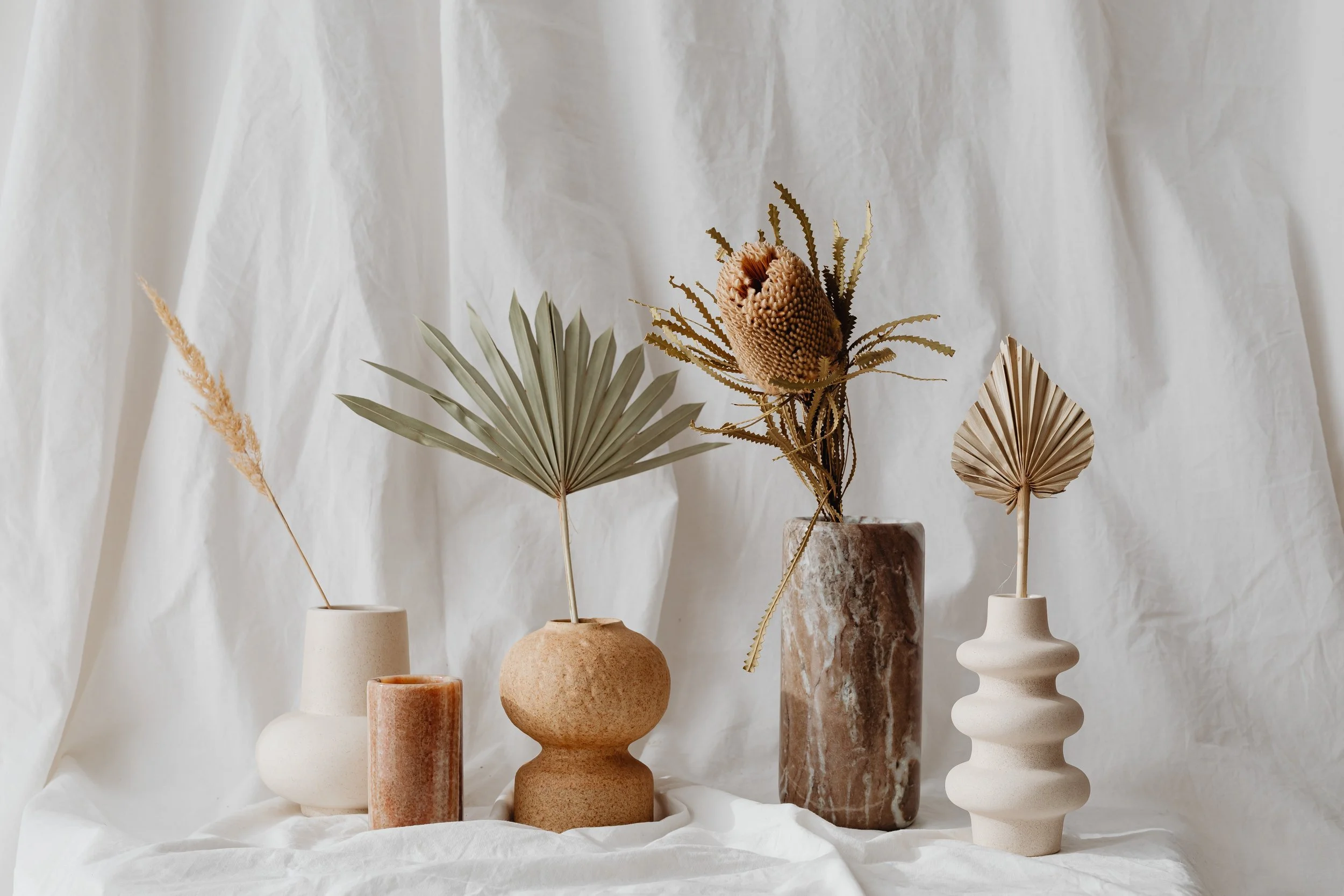 A display of dried florals in a brown marble vase, creating a grounding and peaceful environment for anxiety therapy in Denver.