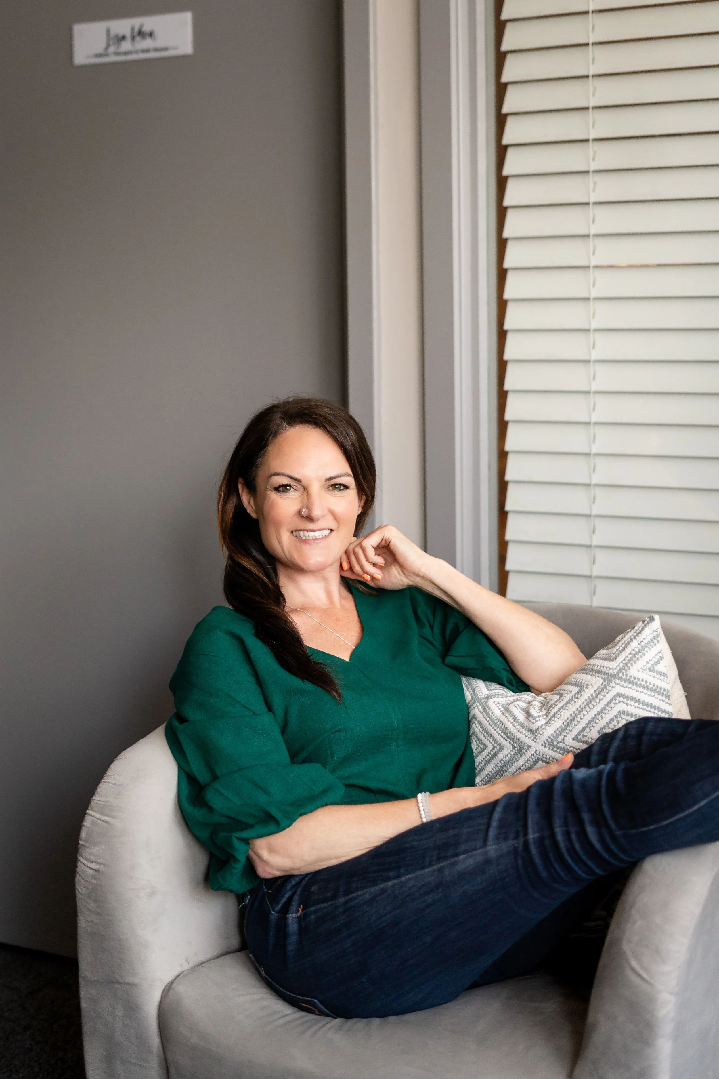 Lisa Kern, Holistic Therapist and Reiki Master, smiling during a casual portrait session for her 1:1 coaching container.