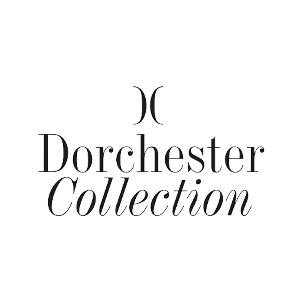 black Dorchester Collection logo on white background