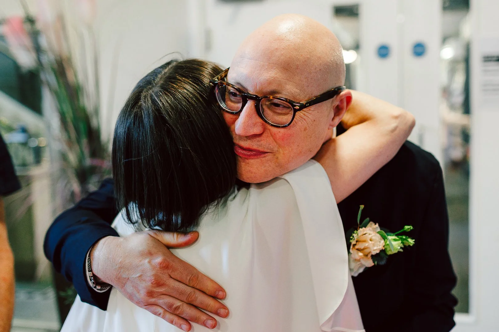 bride hugs guests following her wedding at Sale Town Hall