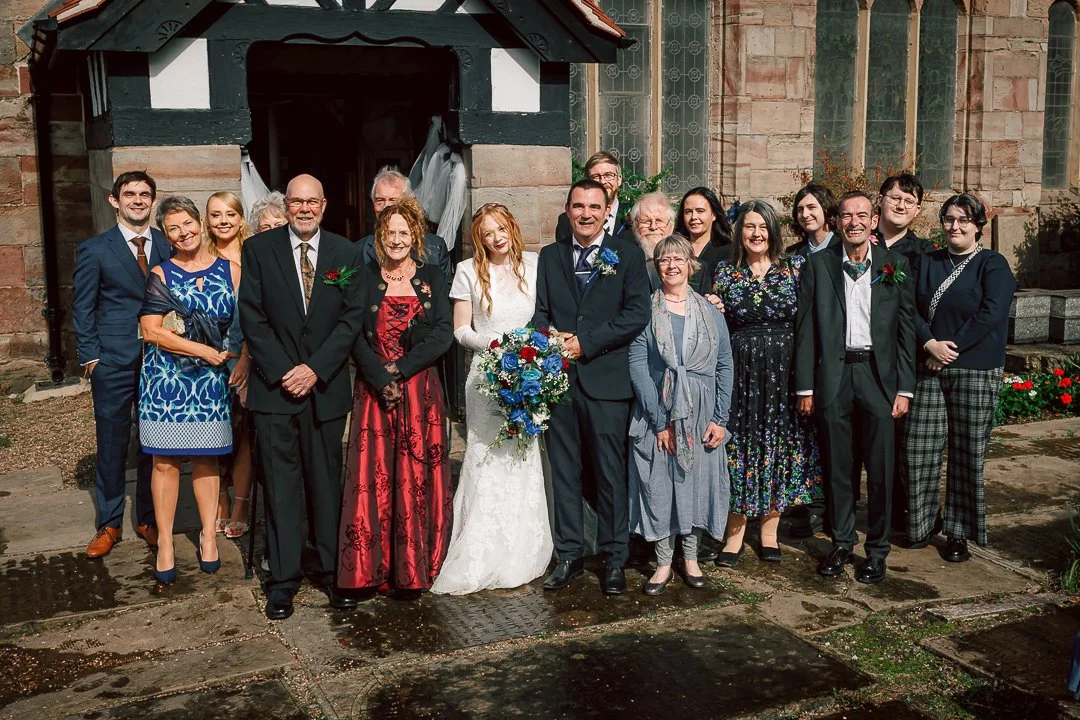 Family and friends gather outside Saint Martins Church in Sale for a group portrait